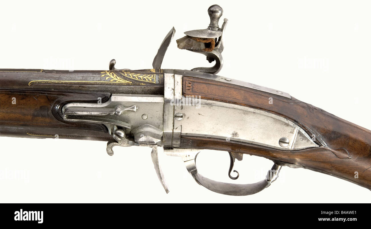 A turn-barrel flintlock short musket, Francois à Cambray, circa 1740. Round, smooth bore barrels in 15 mm calibre with raised sighting flats, old bluing and gold inlaid scroll and leaf decoration on the tops. Smooth flintlocks, the right one signed, 'Francois à Cambray' on the edge. Movable trigger guard to latch the barrel pair in place. Walnut stock with iron furniture. Side mounted ramrod with horn tip. Length 74.5 cm historic, historical, 18th century, civil long guns, gun, weapons, arms, weapon, arm, firearm, fire arm, gun, fire arms, firearms, guns, objec, Stock Photo