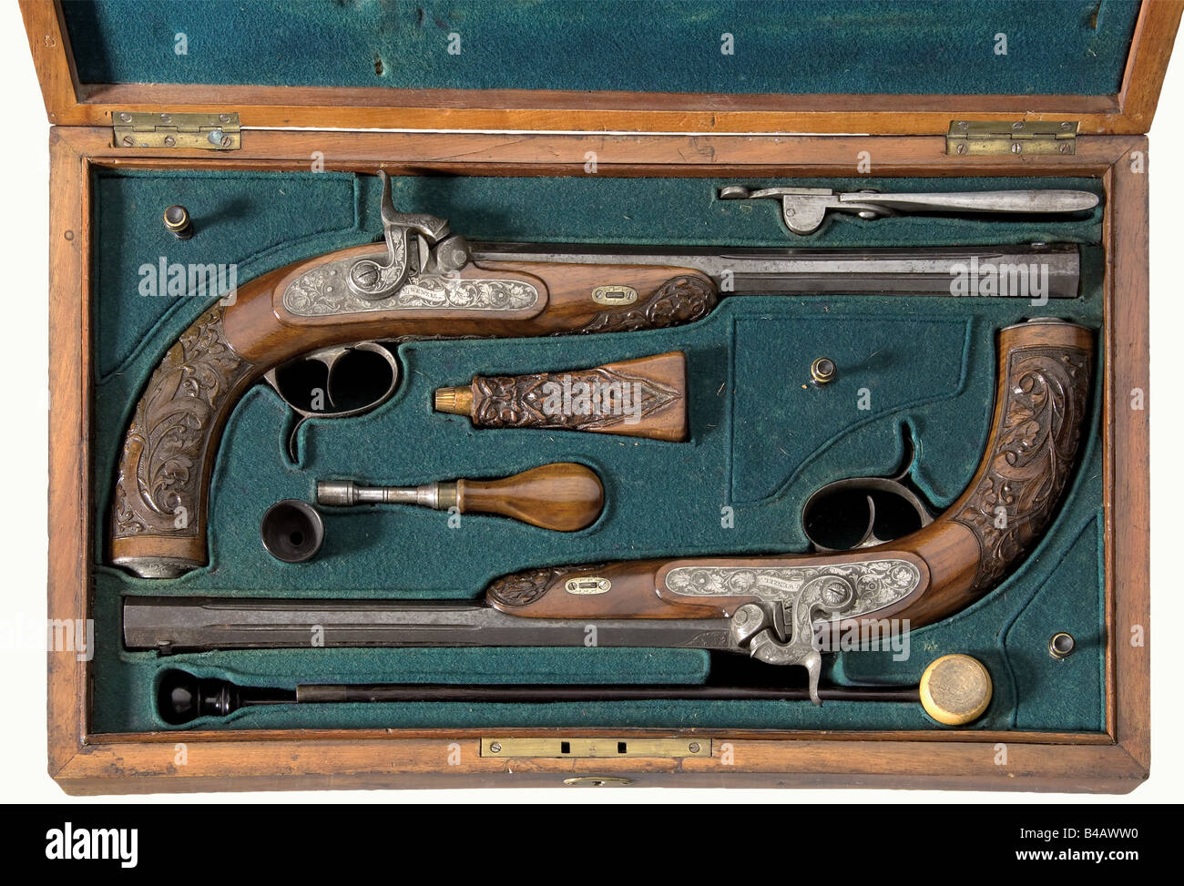 A cased pair of percussion pistols, V. Wenzel, Znaim (=Znojmo) Czechoslovakia. Octagonal, fluted barrels with patent breeches and smooth bores in 9.5 mm calibre. Dovetailed front sights. The tops of the barrels bear floral engraving and each has the signature 'V. WENZEL ZNAIM' as well as the inscription '1' or '2' respectively in gold. Percussion locks with engraved and etched floral decoration and more signatures. Beautifully carved walnut half stocks with iron furniture decorated en suite. The iron parts and blued barrels are lightly pitted or have a film of , Stock Photo