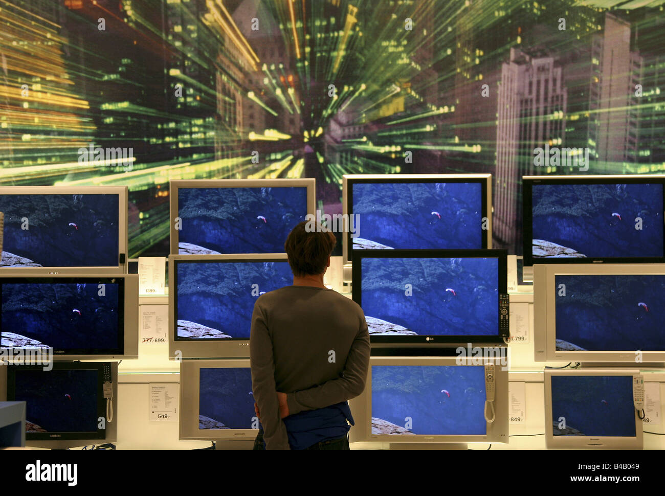 A man in front of television sets, Berlin, Germany Stock Photo