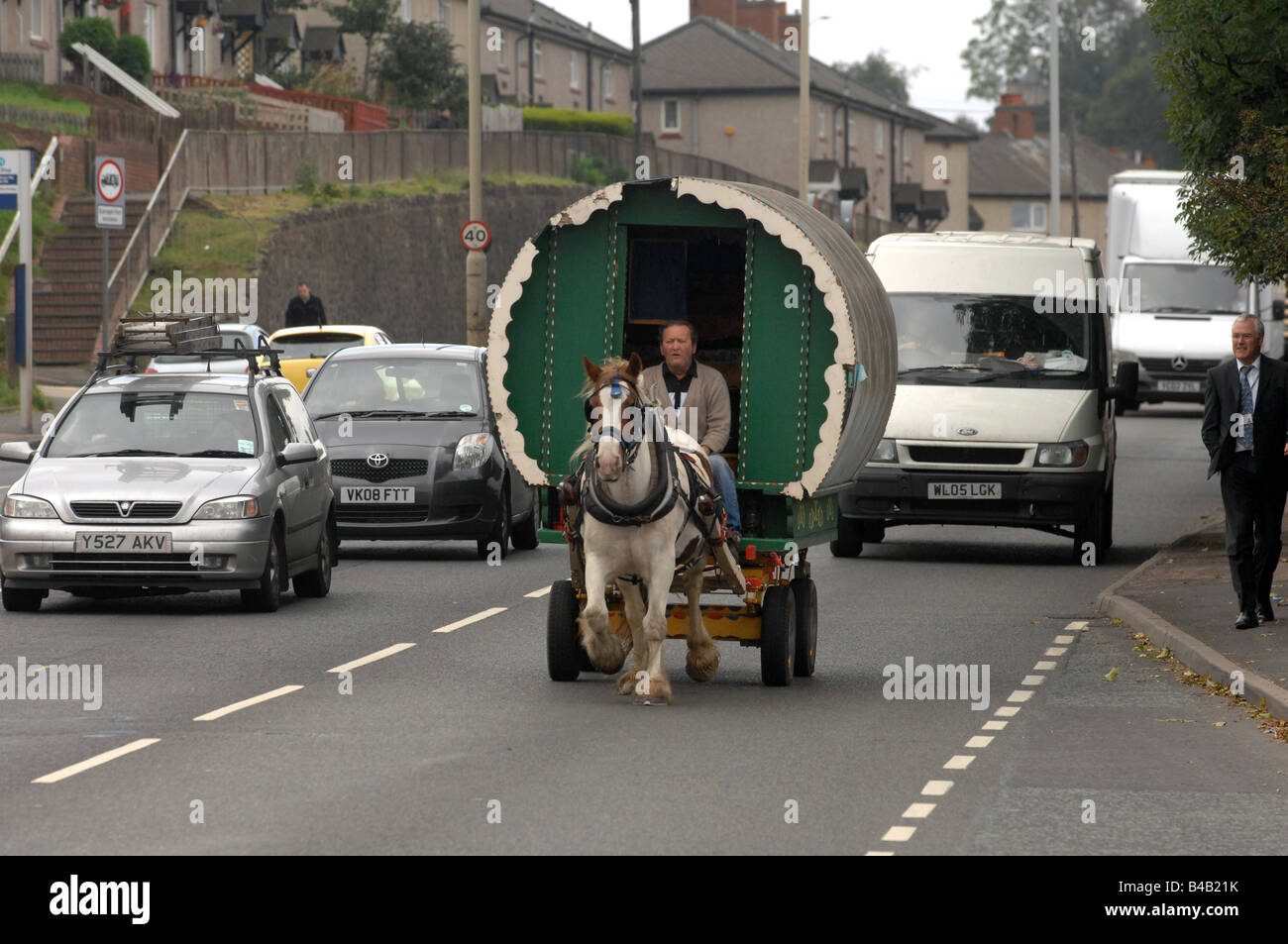 Horse drawn caravan travelling through Dudley in the West Midlands England Stock Photo