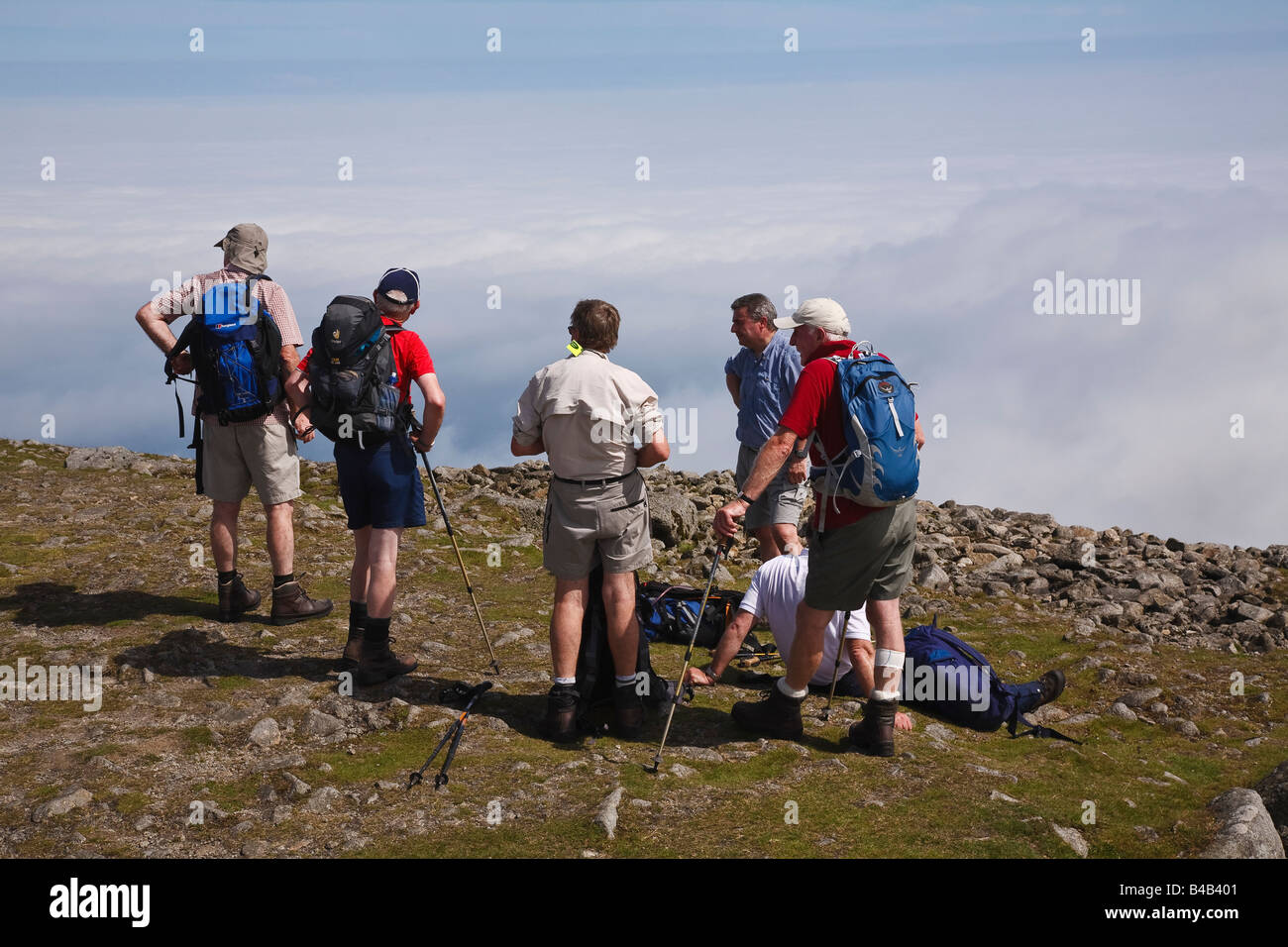 Walkers taking a break on the summit of Slieve Donard, Mourne Mountains, County Down, Northern Ireland Stock Photo