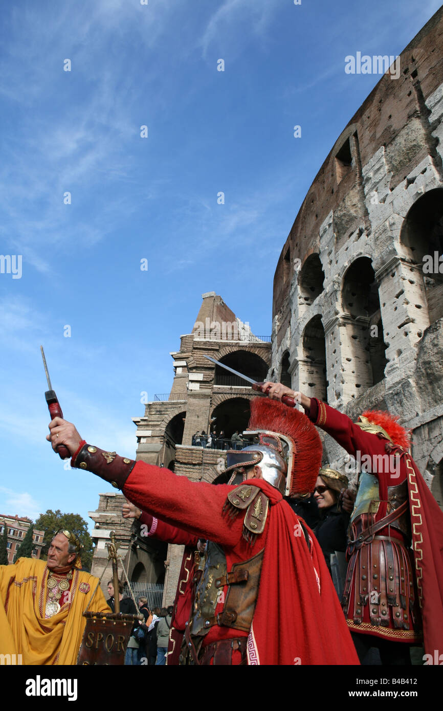 roman centurions with tourists at colosseum rome Stock Photo