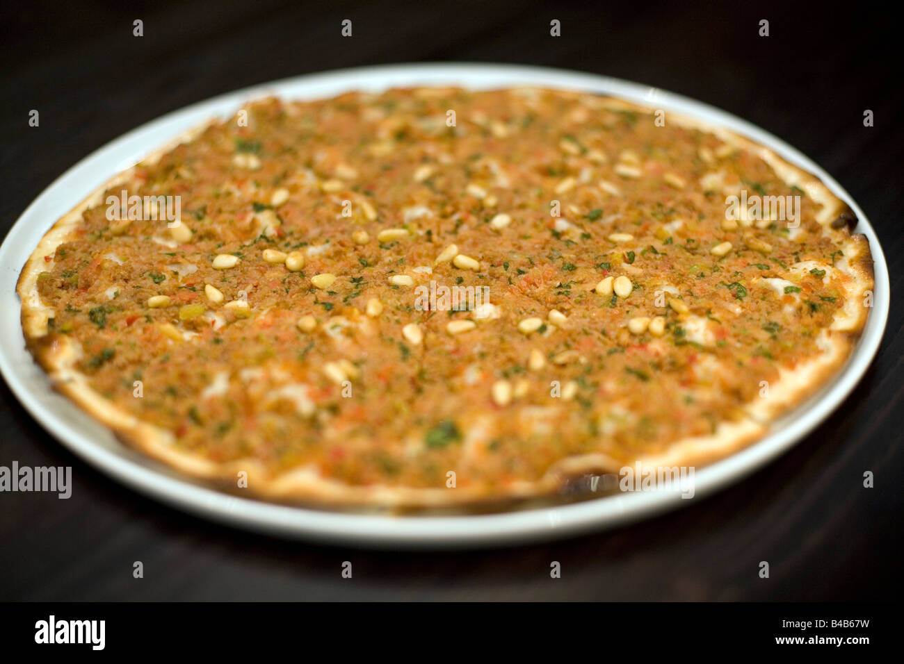 Minced lamb and Pine Kernels pizza Stock Photo - Alamy