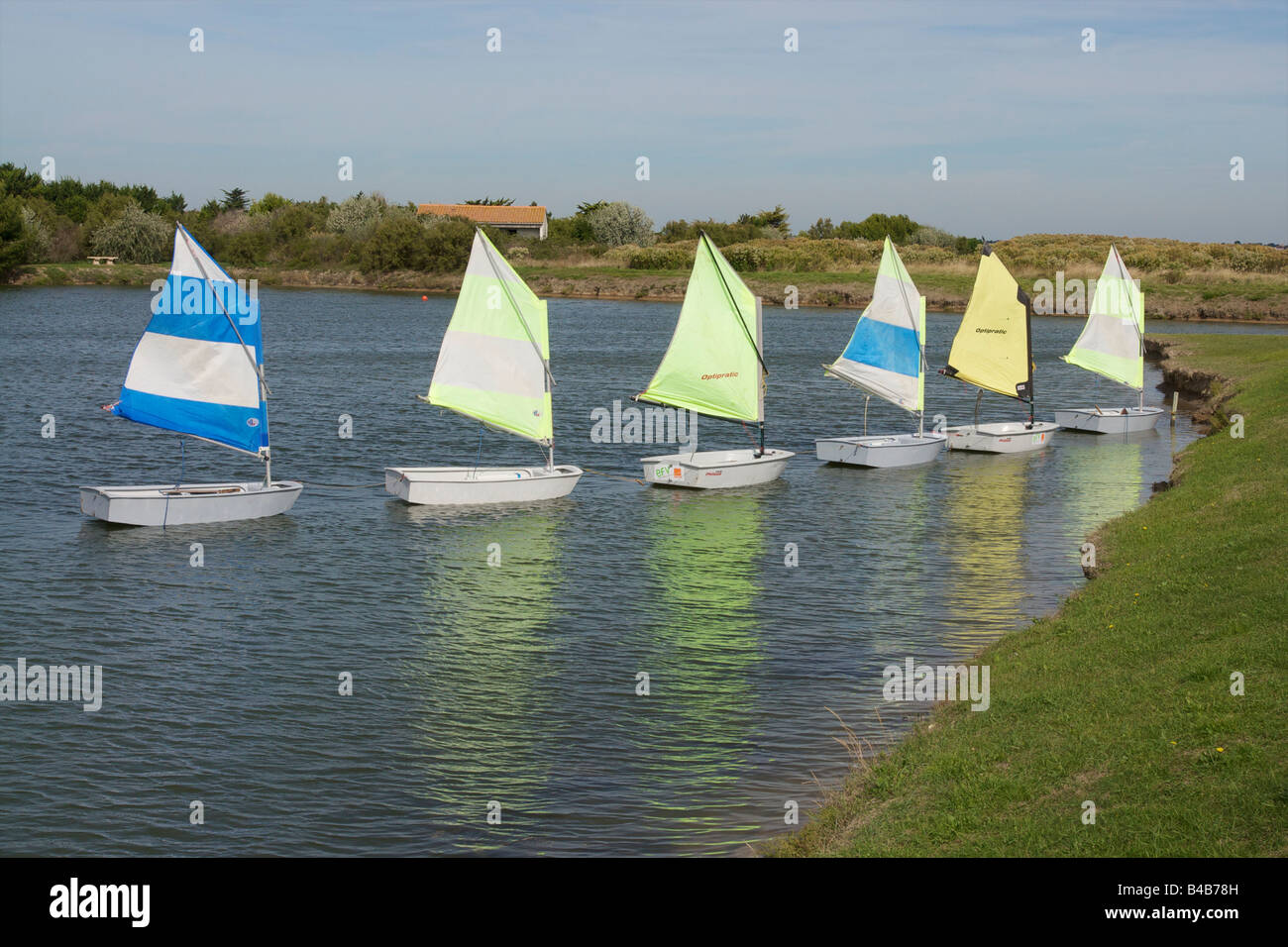 6 sailing dingies moored at the sailing school in Angoulins, France. Stock Photo