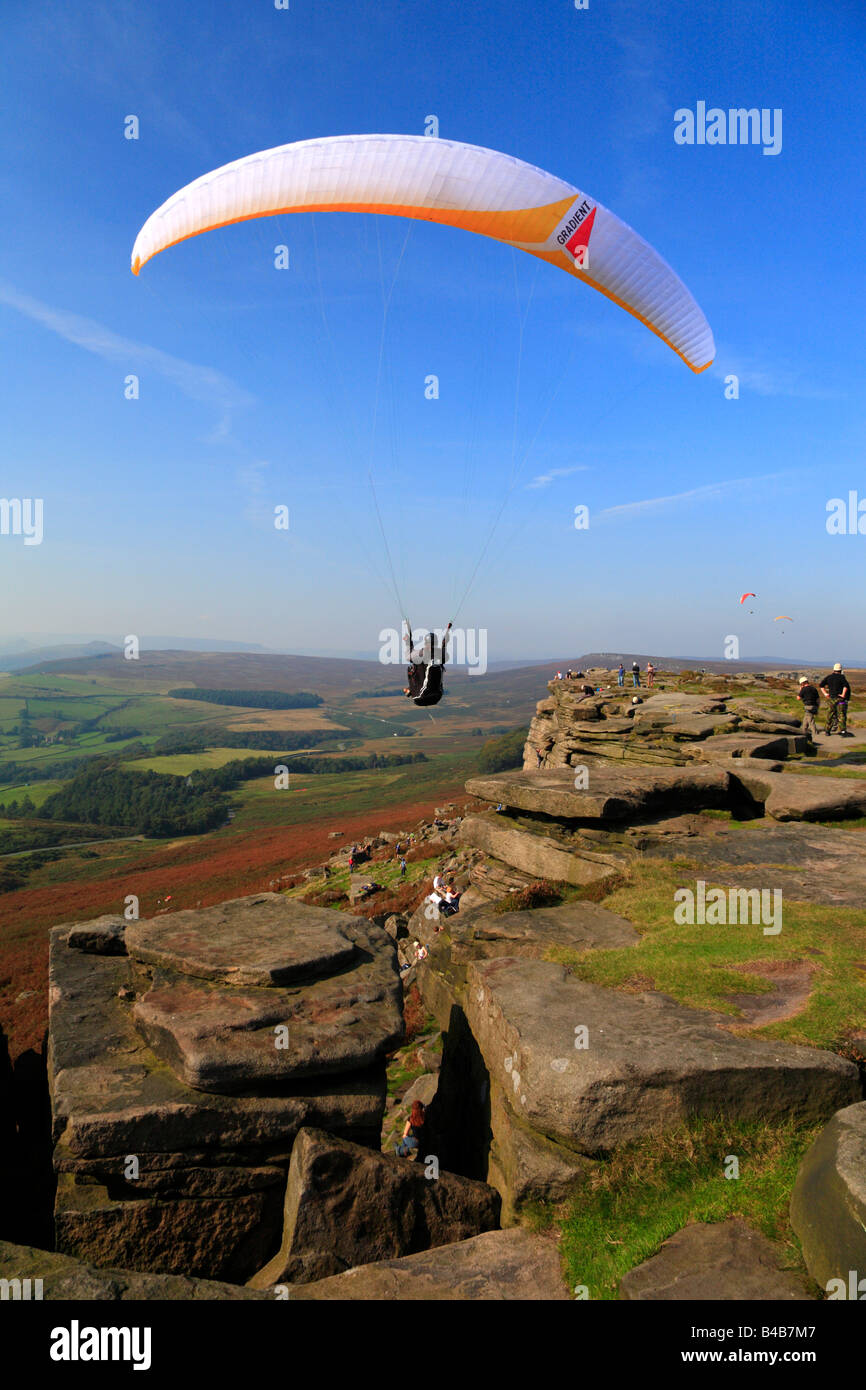 Paraglider on Stanage Edge near Hathersage, Derbyshire, Peak District National Park, England, UK. Stock Photo