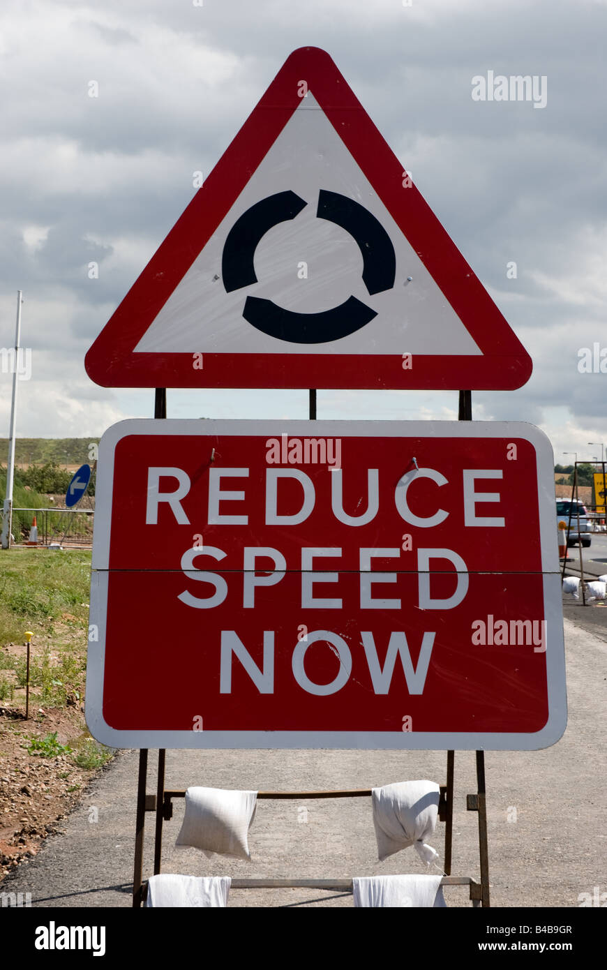 Reduce speed now sign on A1 Stock Photo