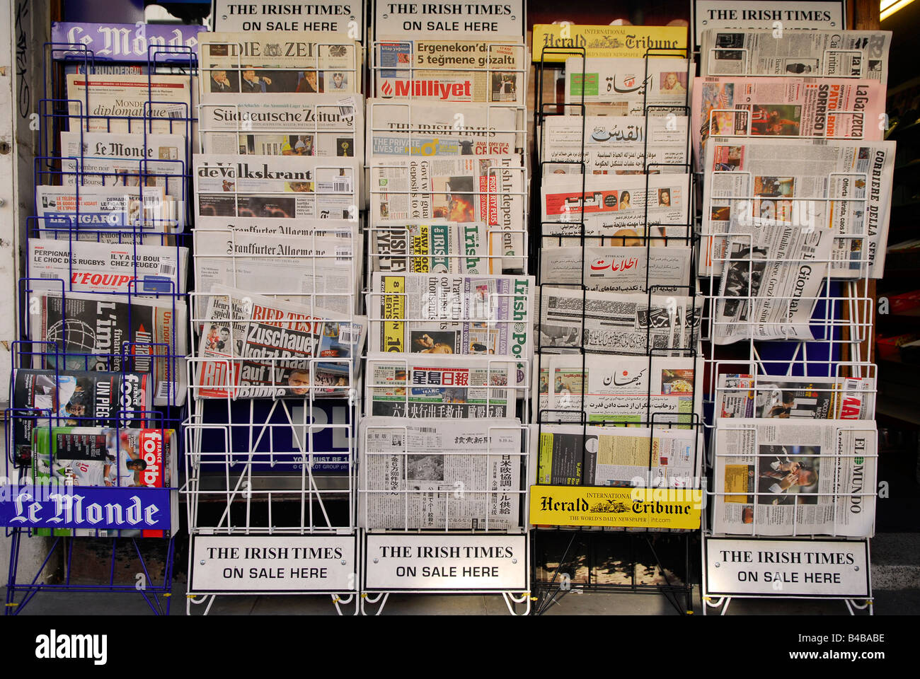 Variety of English and foreign newspapers for sale on a newstand, Chiswick, west London, UK. Stock Photo