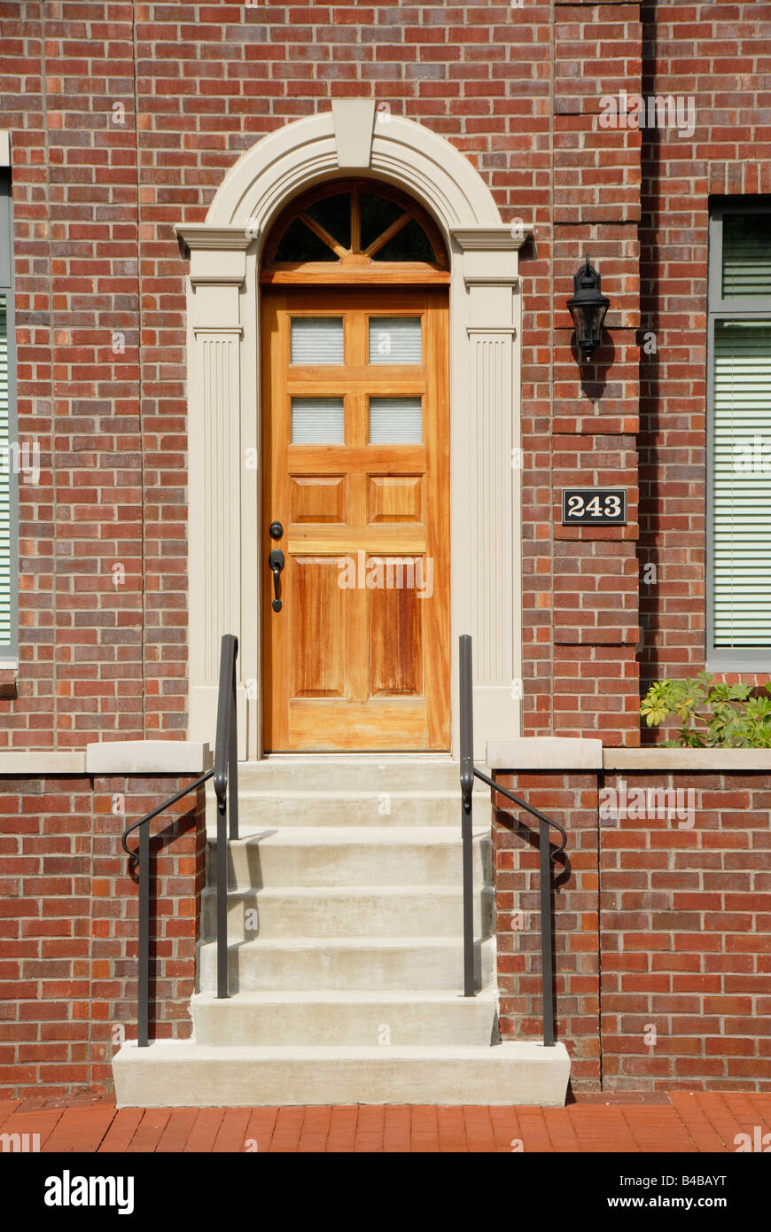 Red brick building and arched door Stock Photo