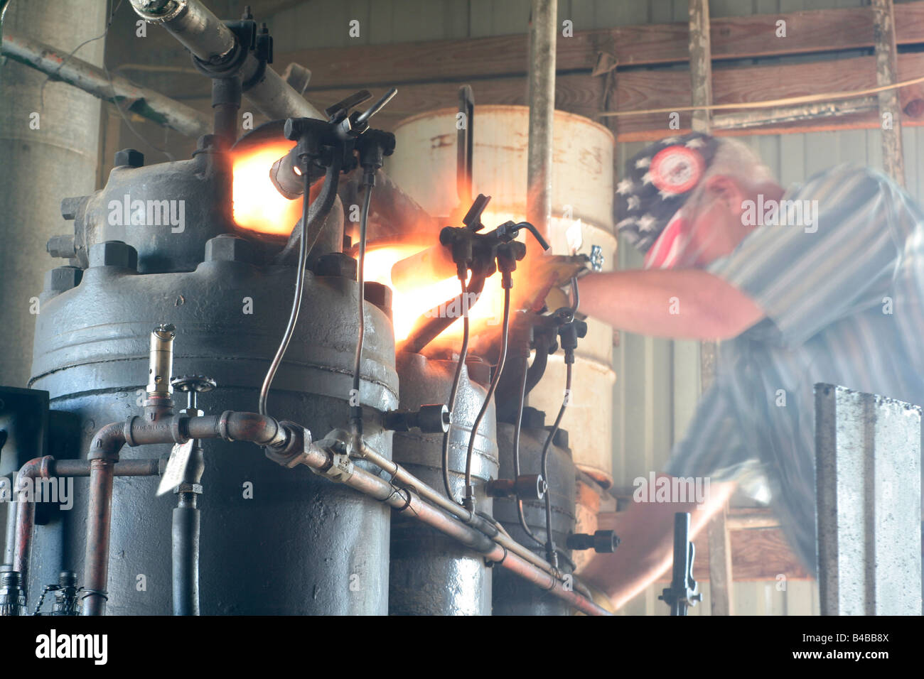 Firiery start for an old semi-diesel stationary engine Stock Photo