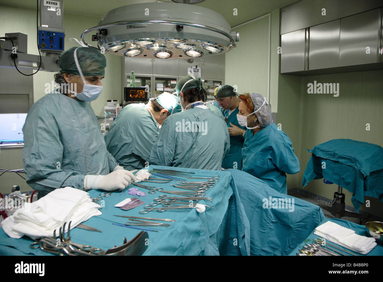 surgical team in operating theatre and instruments laid out ready. Stock Photo