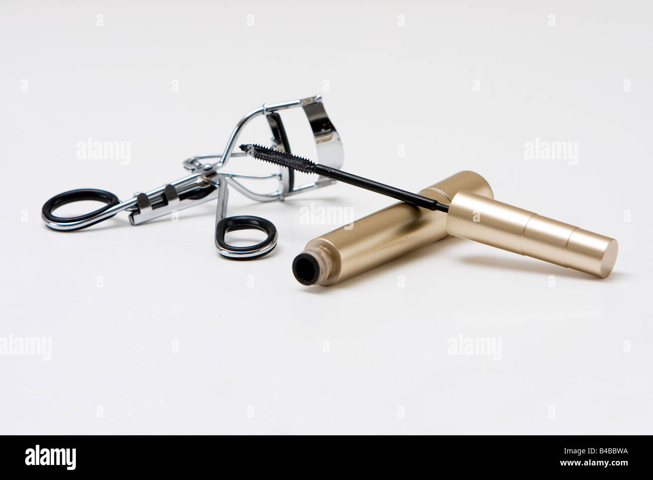 Eye makeup supplies with mascara and curler isolated Stock Photo Alamy