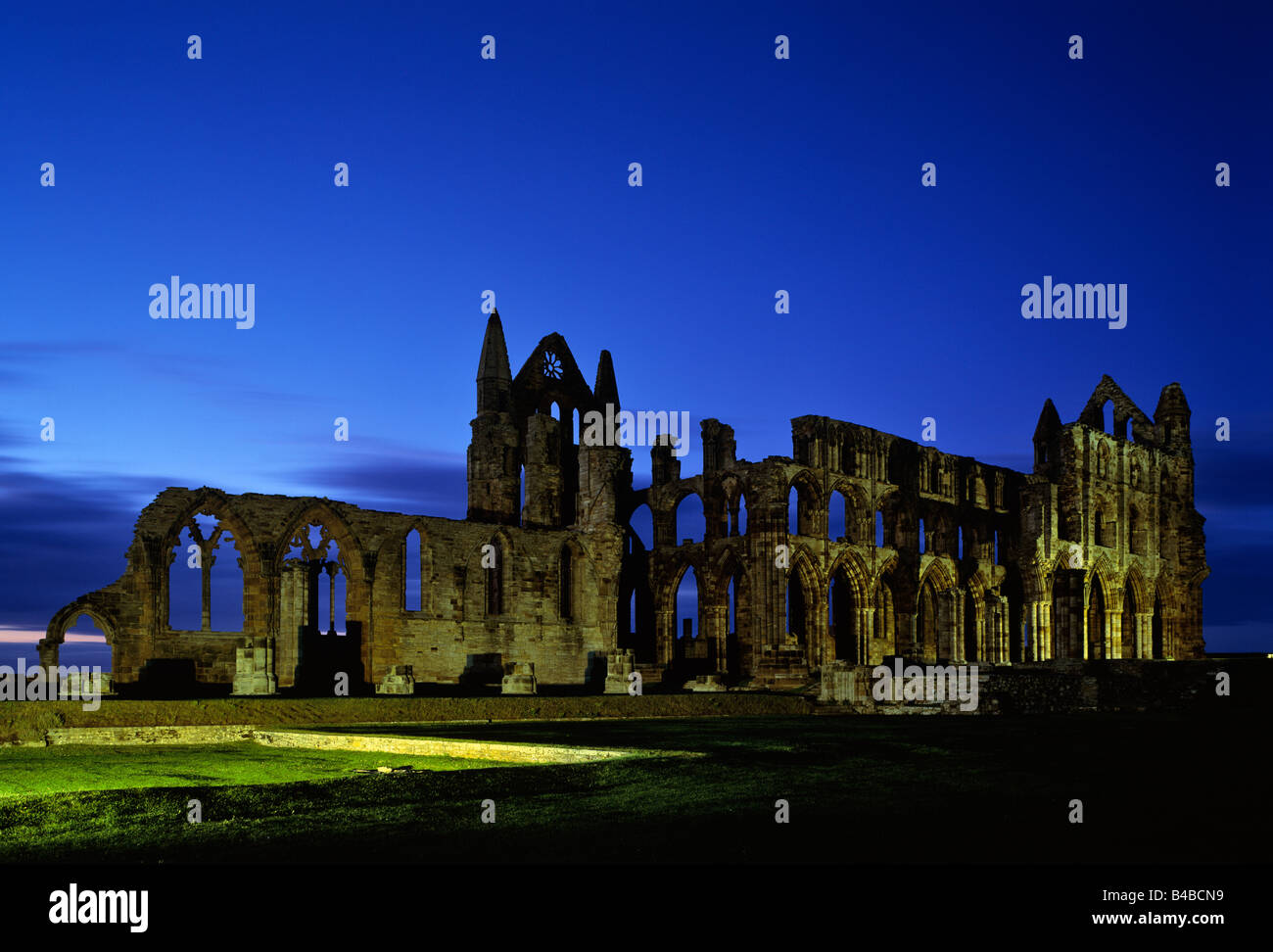 A nightime floodlit shot of Whitby Abbey Stock Photo