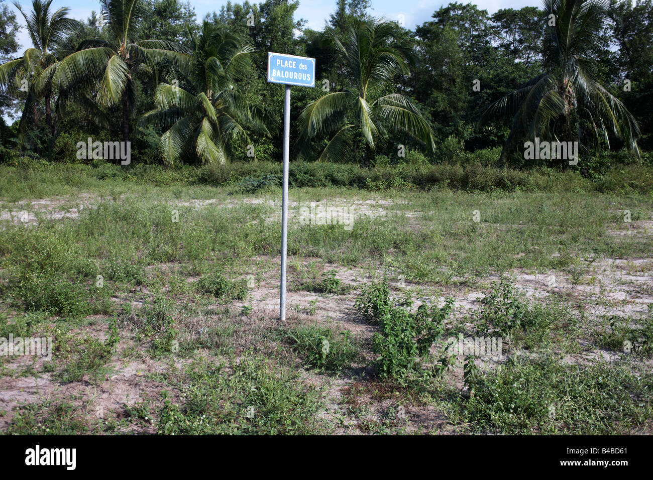 Sign post for a desolate Place Balourous on wasteland scrub near Kourou River in colonial quarter of Kourou, French Guiana Stock Photo