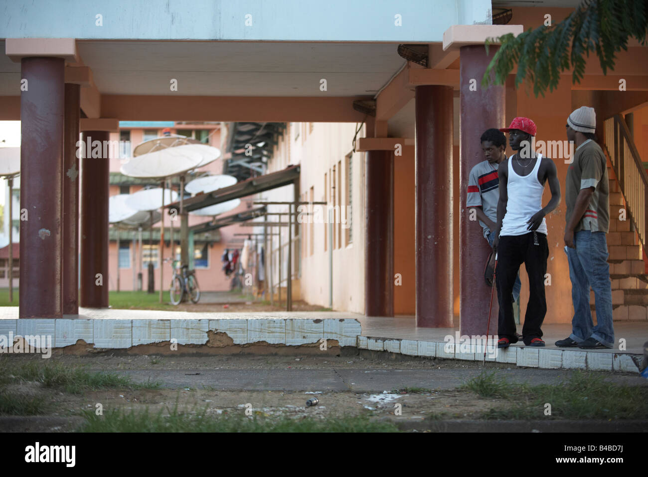 Young men in a ghetto housing estate in town of Kourou in French Guiana, home of the European Space Agency’s Spaceport Stock Photo