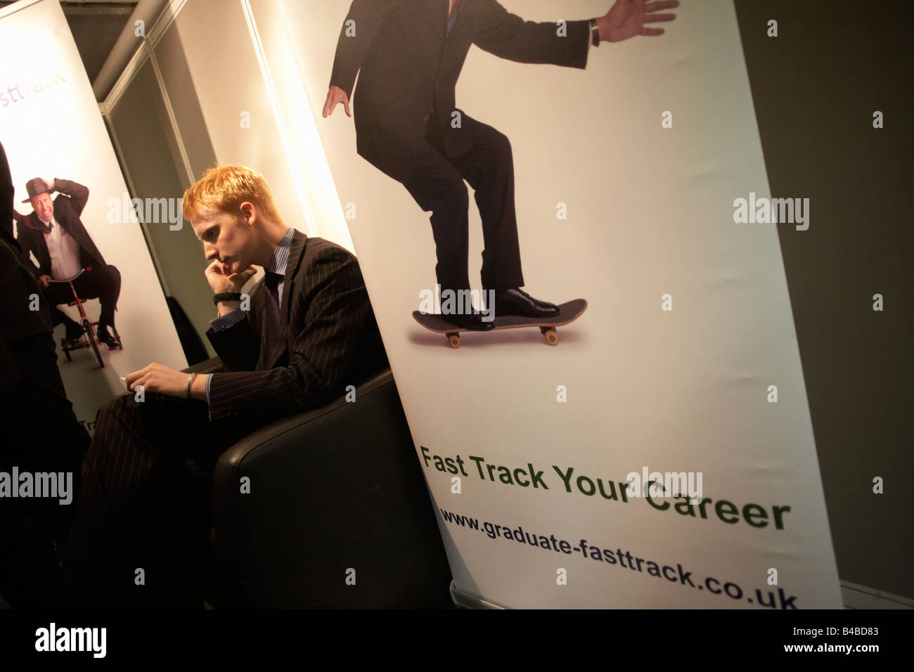 Making life-changing calls at a graduate expo fair where company job recruiters meet young people starting work Stock Photo