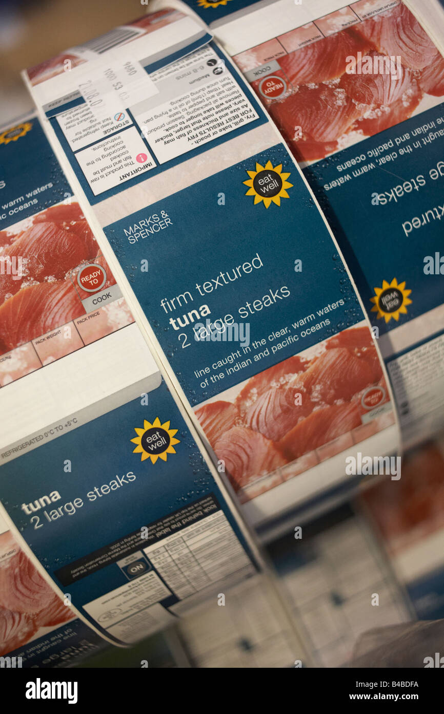 A roll of sticky labels for tuna steaks lie in stationery cupboard destined for the shelves of retail chain Marks & Spencer Stock Photo