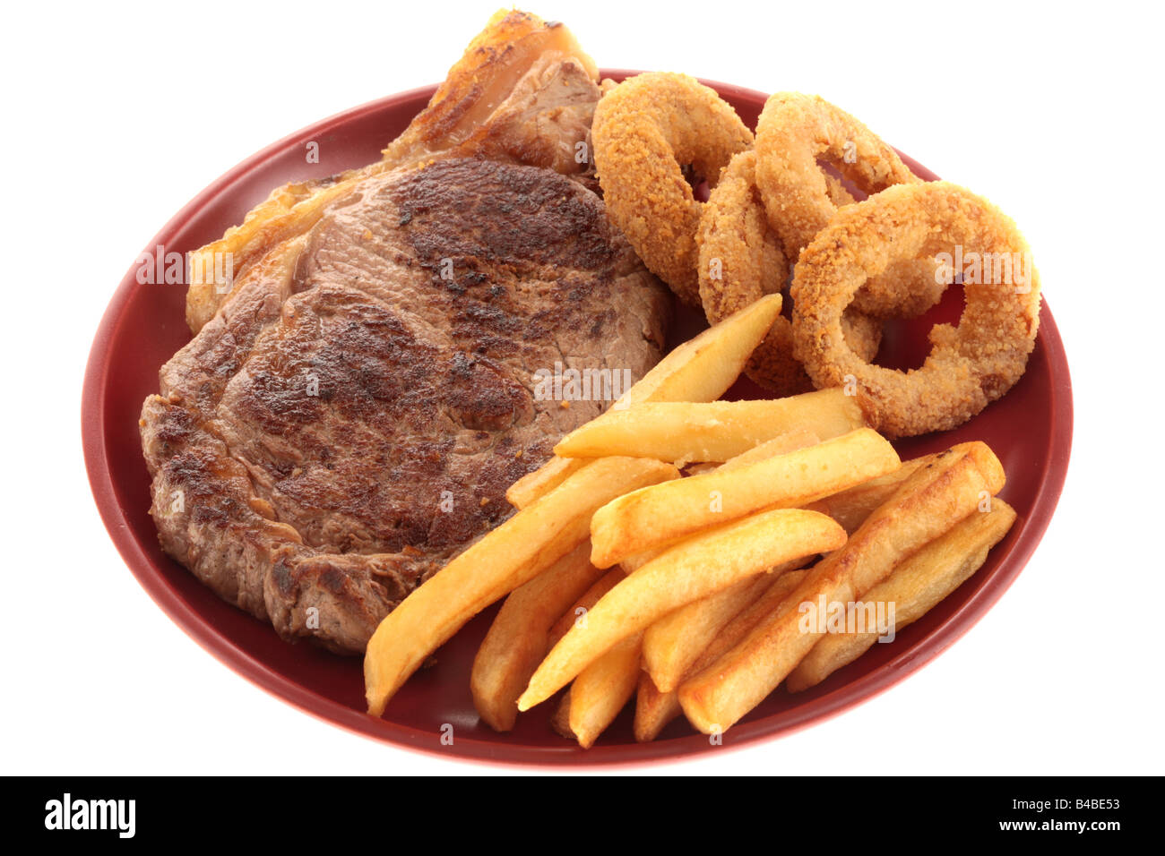 Fresh Sirloin Beef Steak With Chips And Onion Rings Isolated Against A