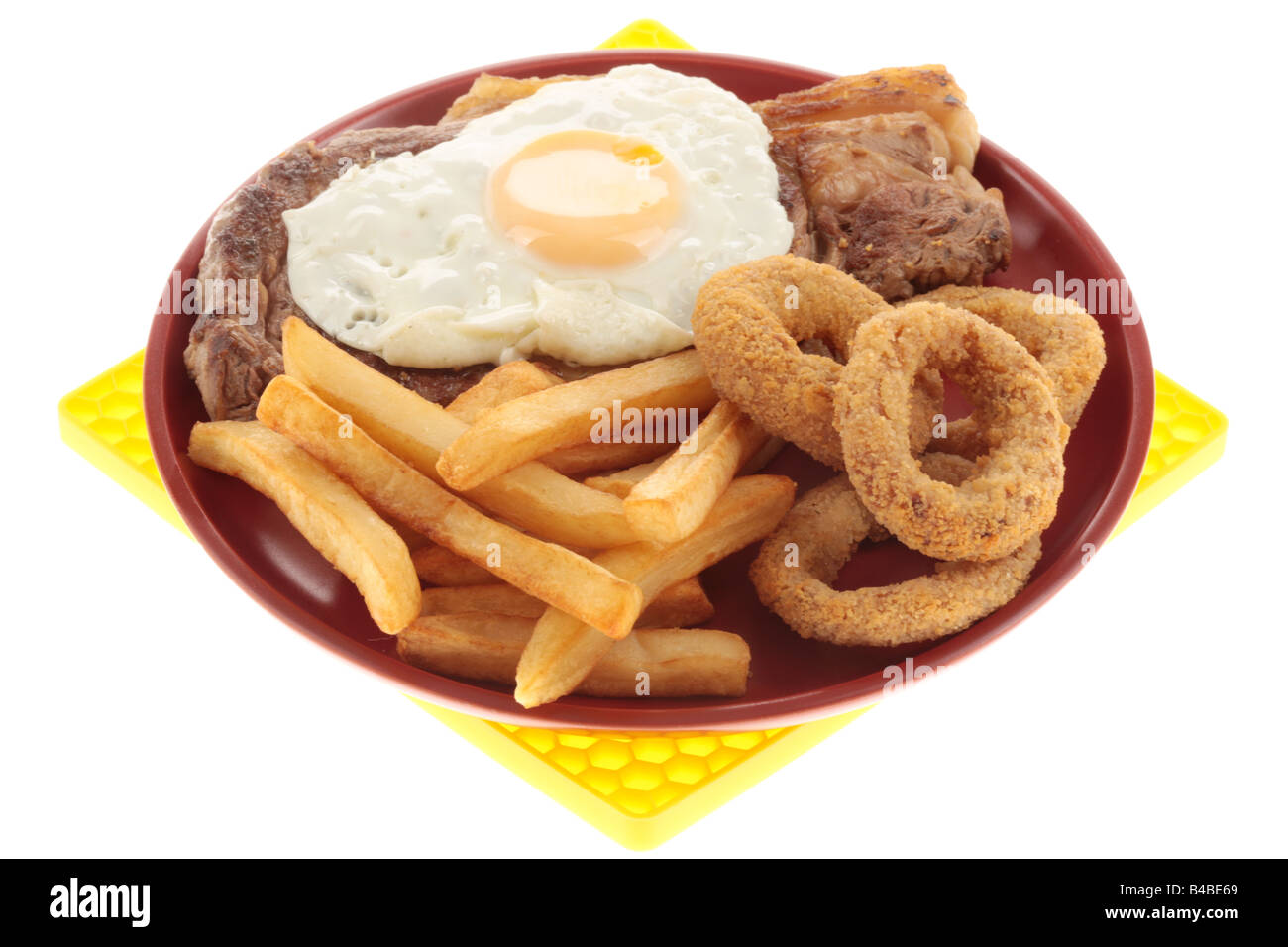 Fresh Sirloin Beef Steak With A Fried Egg, Onion Rings And Chips