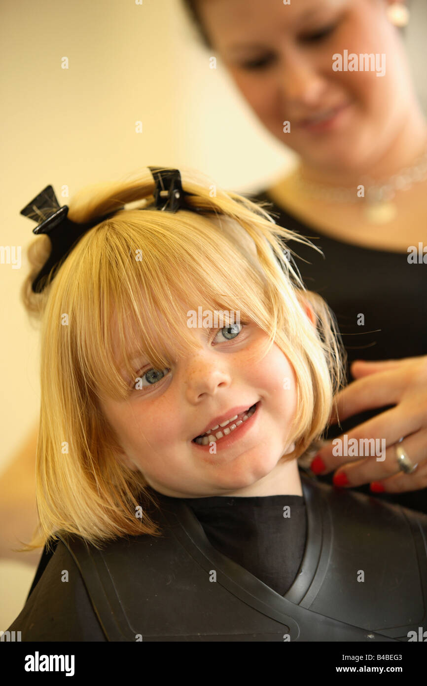 A Young Girl Having Her Haircut At A Hairdressers Stock Photo Alamy A Young Girl Having Her Haircut At A Hairdressers Stock Photo Alamy