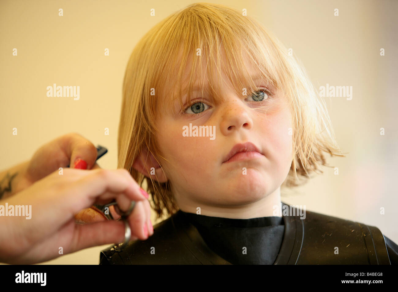 A Young Girl Having Her Haircut At A Hairdressers Stock Photo Alamy A Young Girl Having Her Haircut At A Hairdressers Stock Photo Alamy