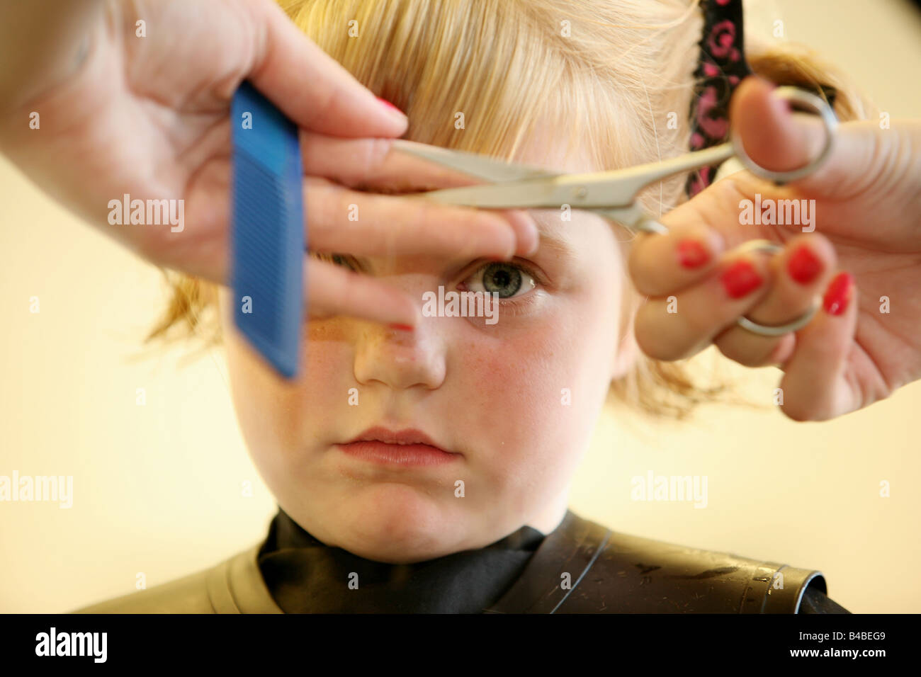 A Young Girl Having Her Haircut At A Hairdressers Stock Photo Alamy A Young Girl Having Her Haircut At A Hairdressers Stock Photo Alamy