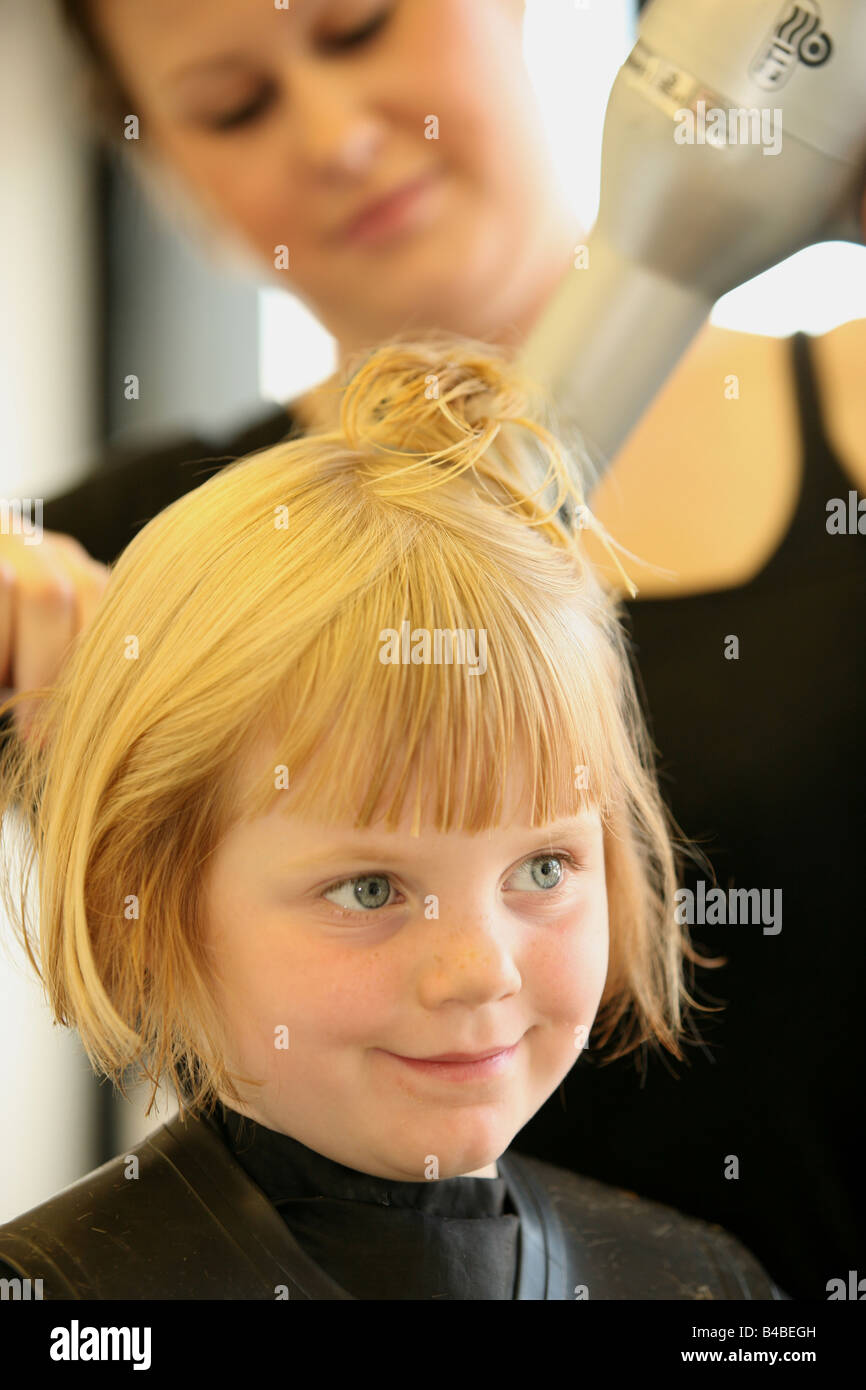 a young girl at a hairdressers Stock Photo Alamy