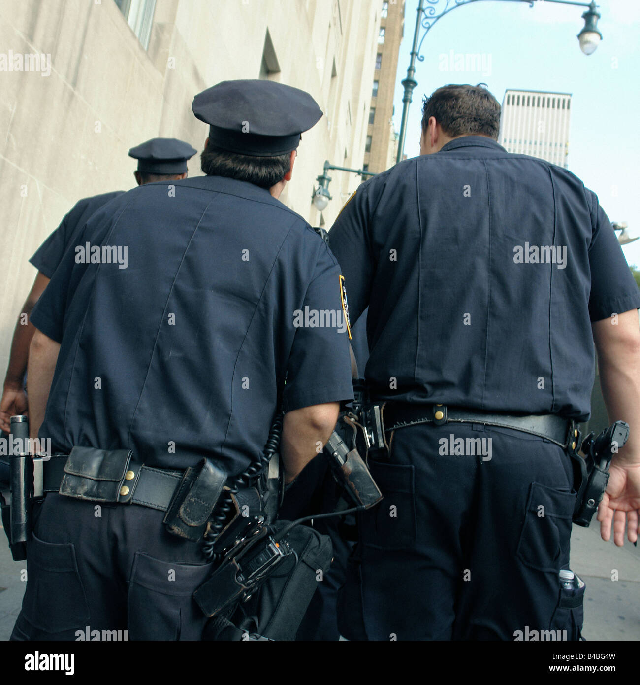 Three New York City Police Officers Walking Viewed From Behind Taken on ...