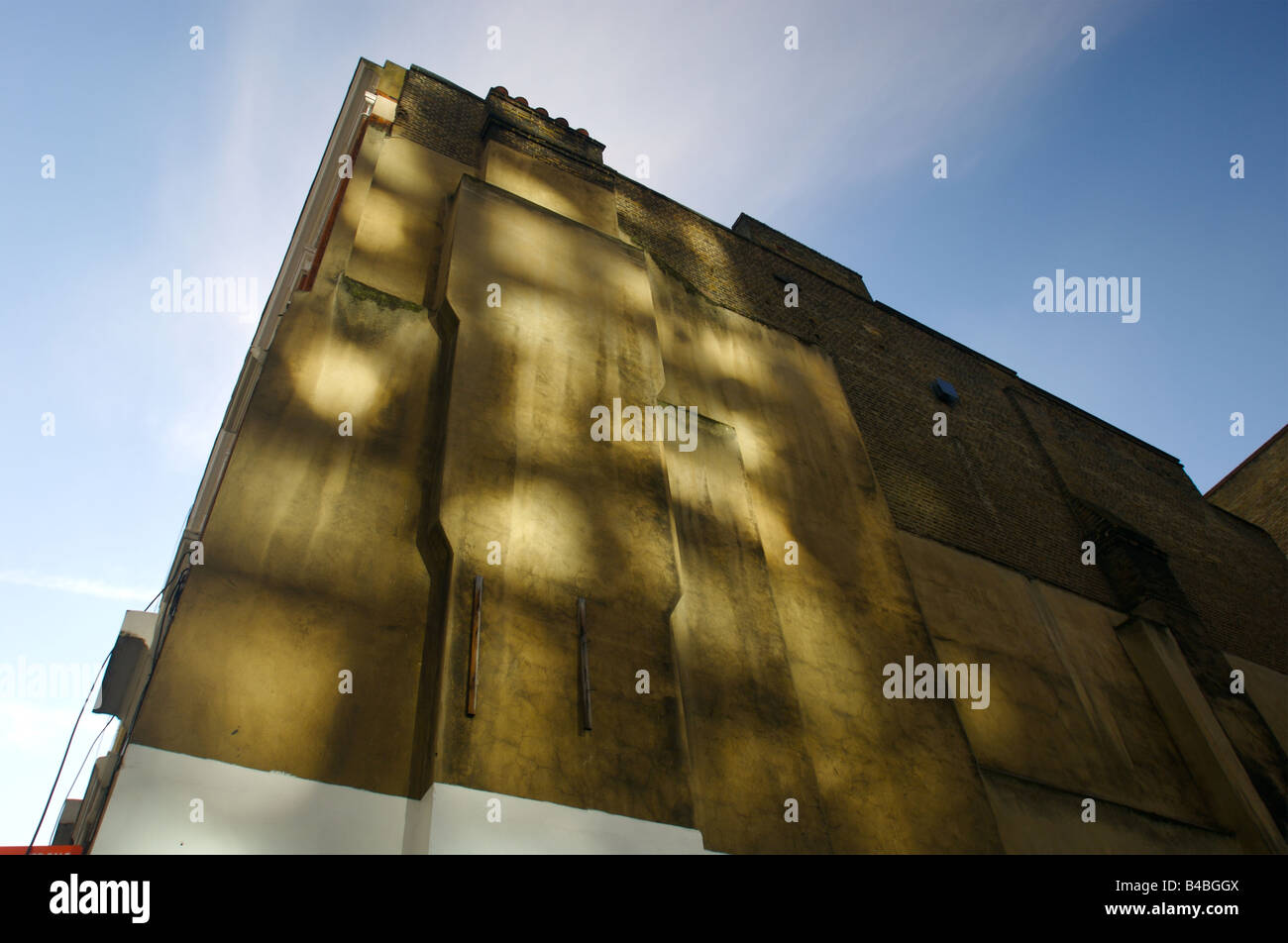 Sunlight reflected of a mirrored buliding streaming onto another building in central London Stock Photo