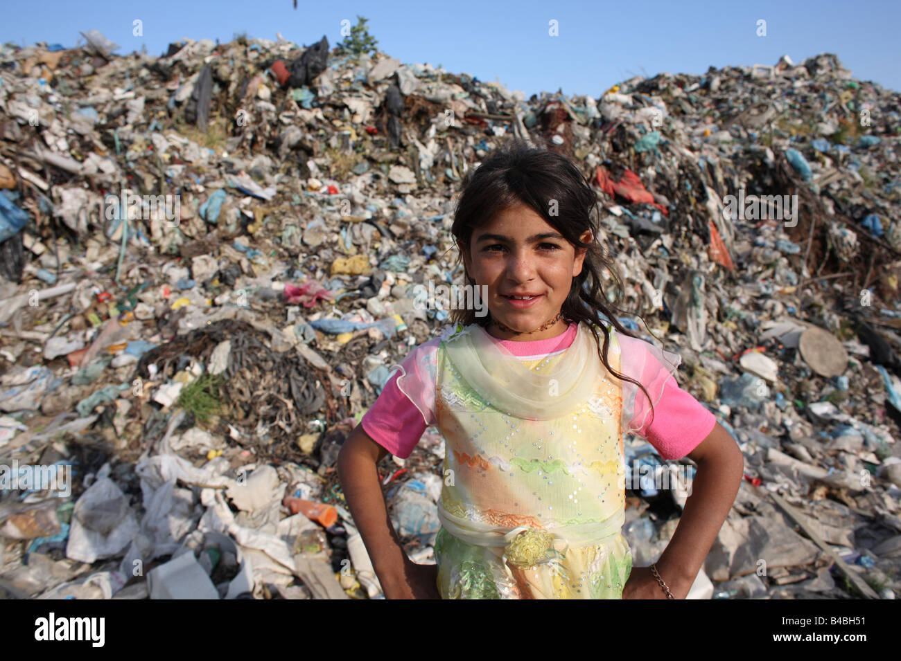 Roma gypsy girl standing in front of rubbish pile in Share, a slum next to  a rubbish dump on the outskirts of Tirana, Albania Stock Photo - Alamy