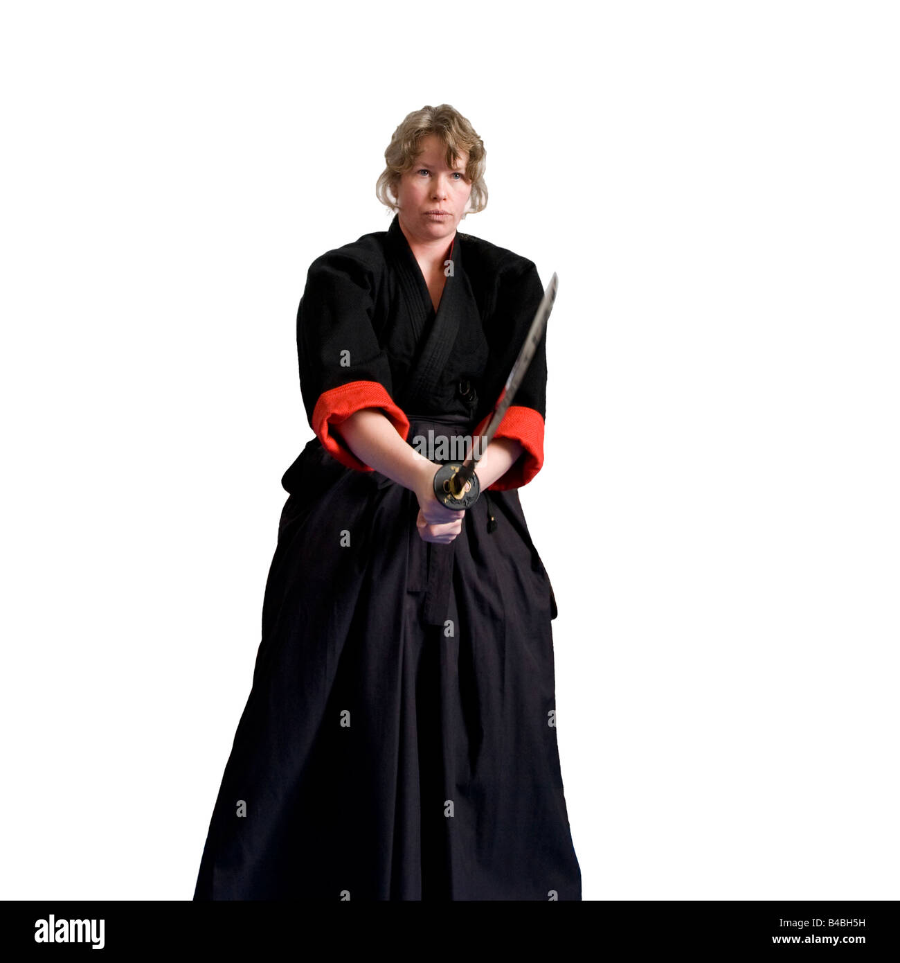 Female martial art fighter performance in a traditional outfit Stock