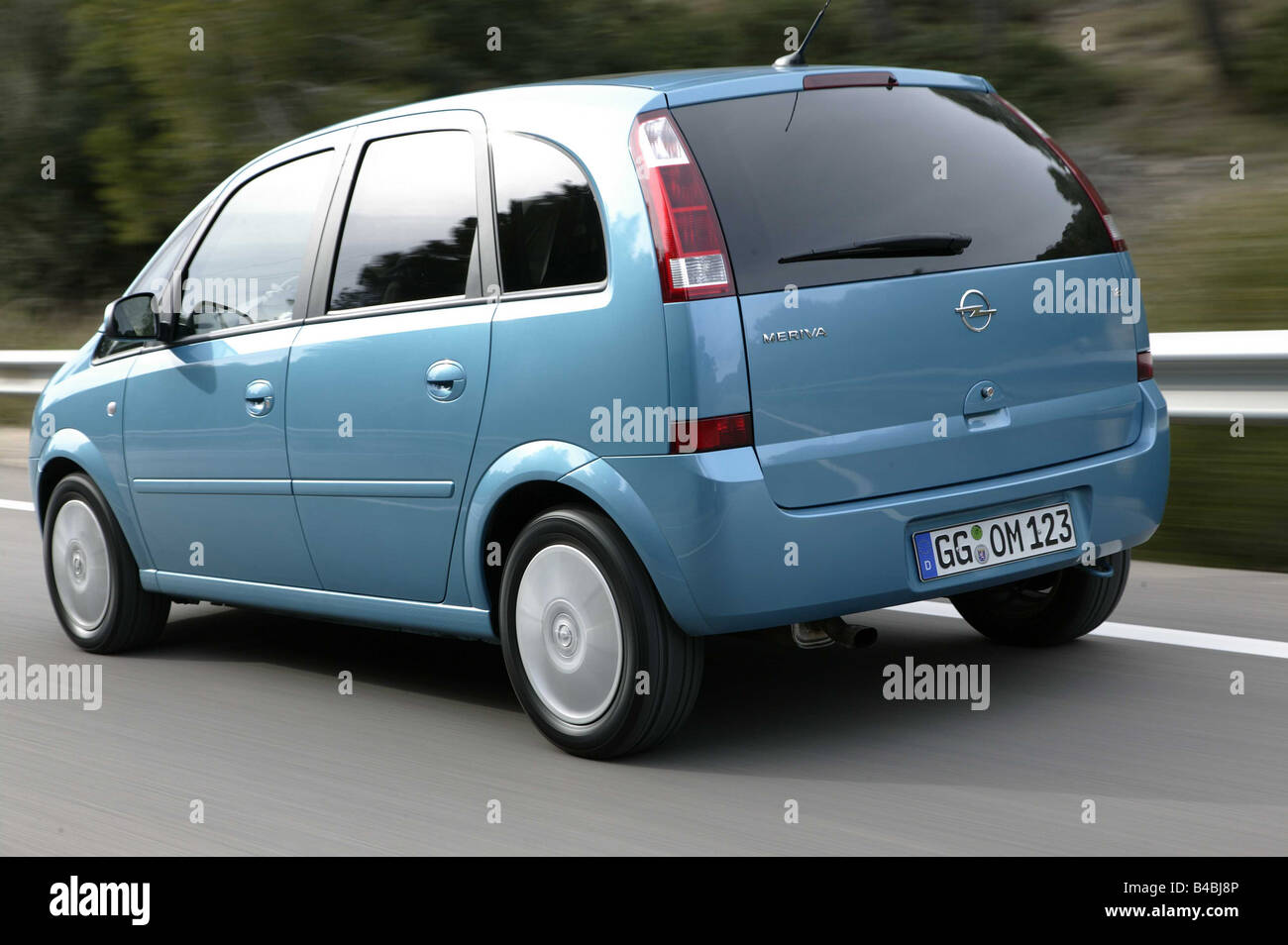 Car, Opel Meriva, Van, Limousine, model year 2003-, light blue-metallic,  driving, country road, diagonal from the back Stock Photo - Alamy
