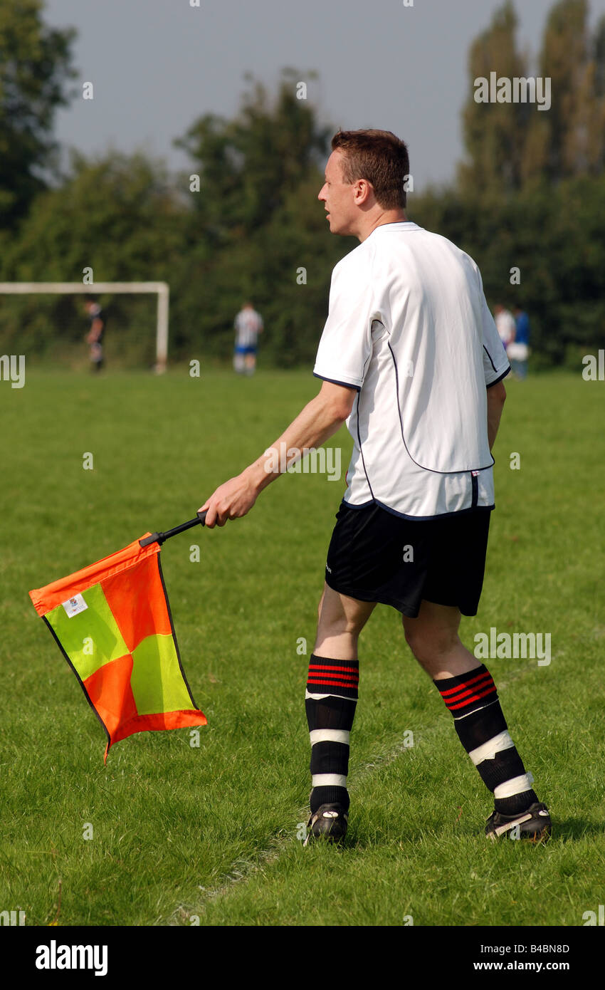 Sunday League football linesman with flag, Leamington Spa, UK Stock