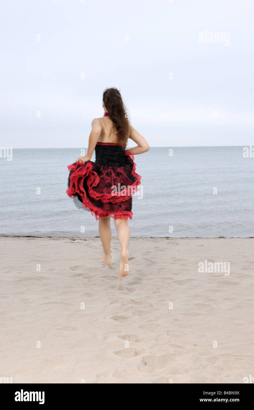 Woman run rear view dress hi-res stock photography and images - Alamy