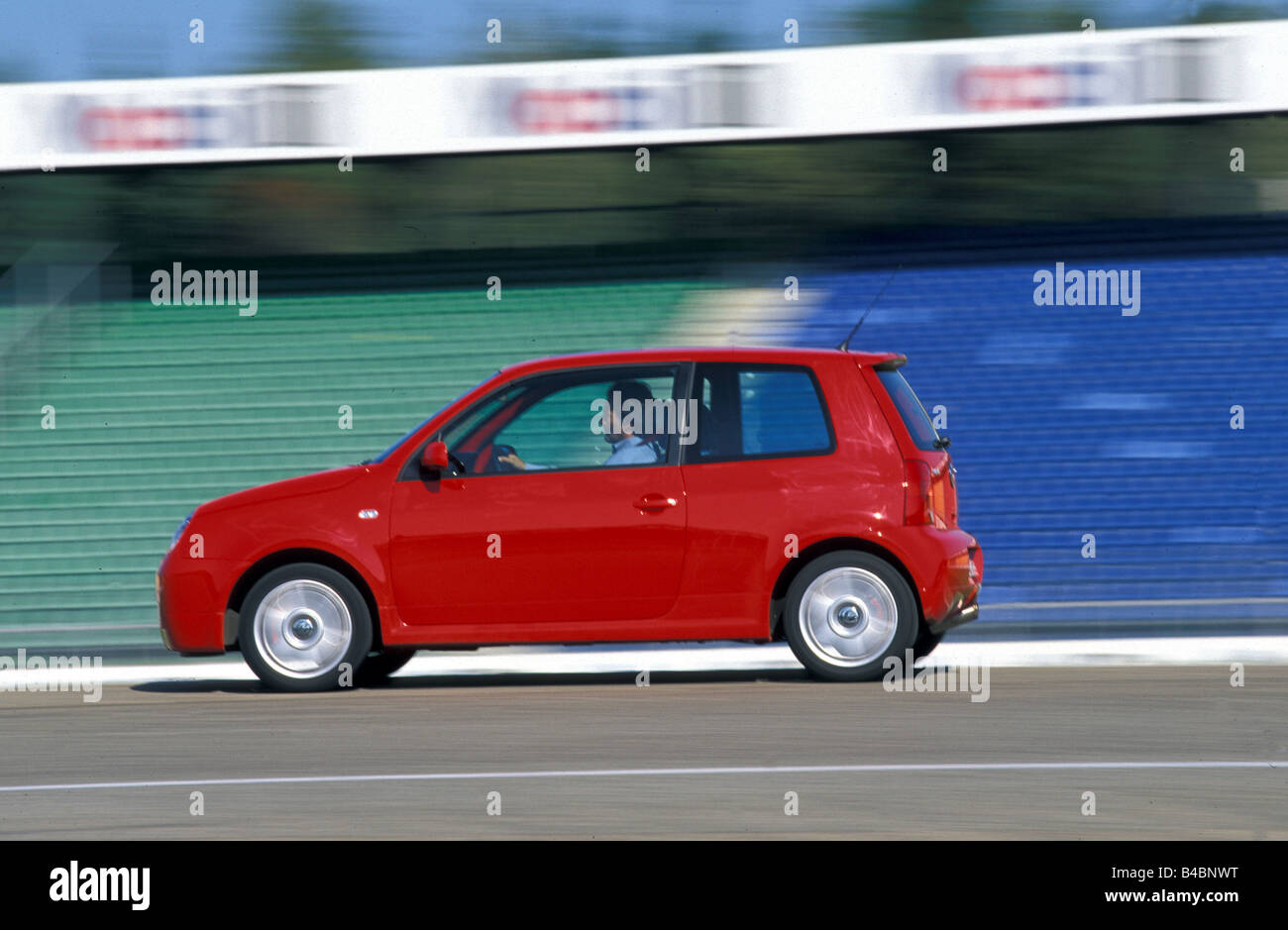 Car, VW Volkswagen Lupo GTI, model year 1998-2003, red, Miniapprox.s, Limousine, FGHDS, Tuning, tuned cars, driving, side view, Stock Photo