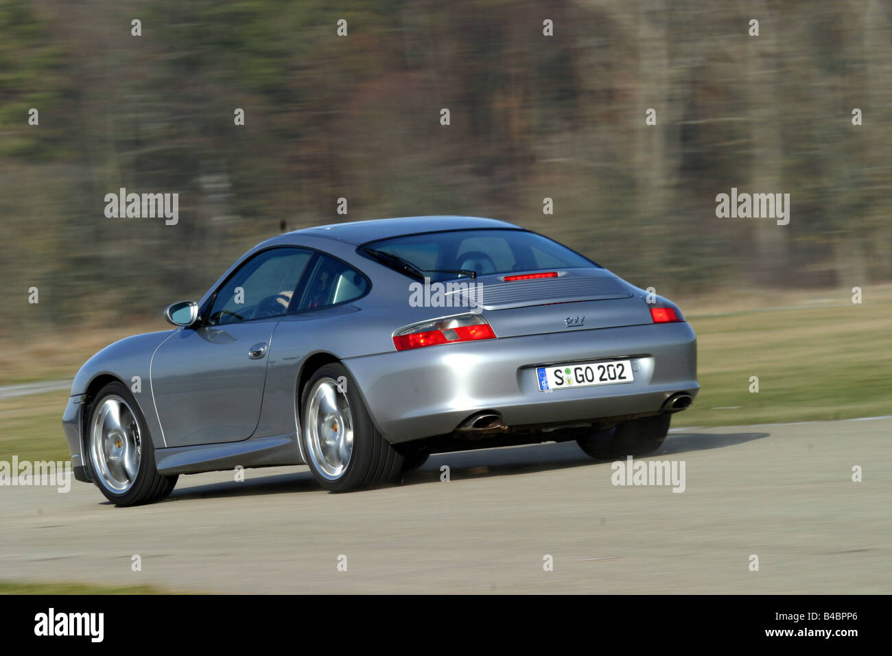 Car, Porsche 911, 40 years, model year 2003-, silver/anthracite, roadster, coupe/Coupe, FGHDS, driving, diagonal from the back, Stock Photo