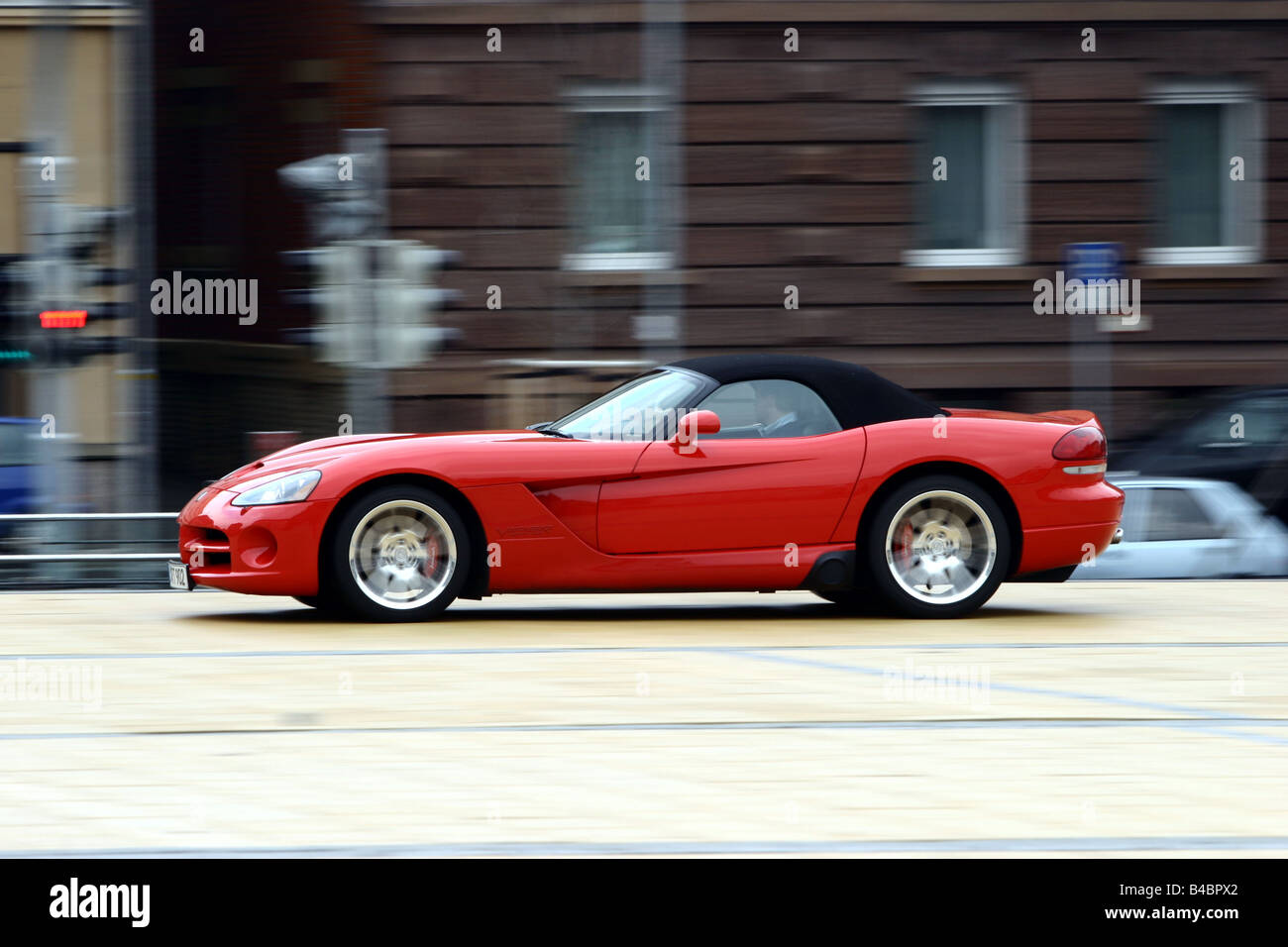 Car, Dodge Viper SRT-10, Convertible, model year 2003-, red, FGHDS, closed top, driving, side view, City Stock Photo