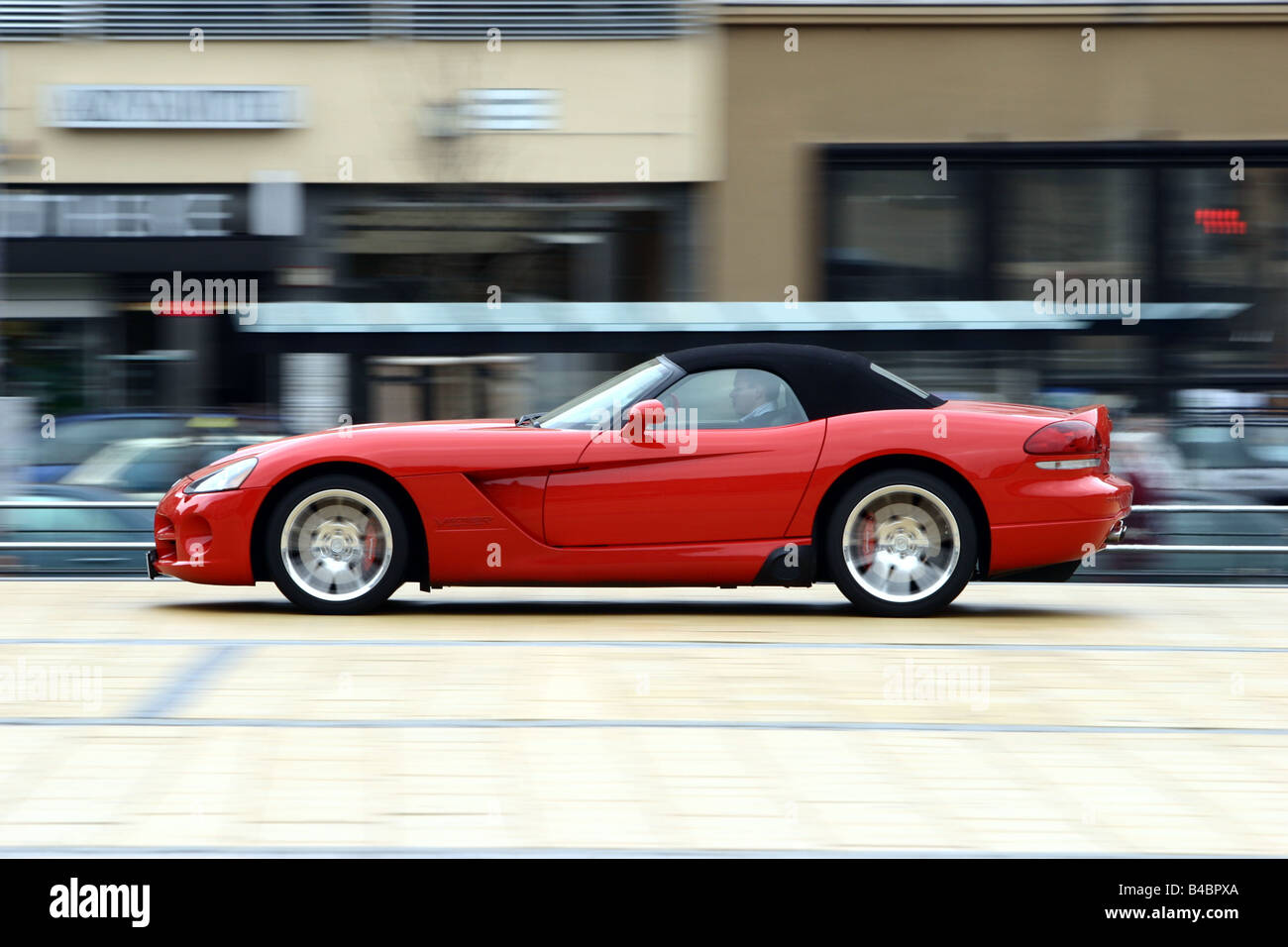 Car, Dodge Viper SRT-10, Convertible, model year 2003-, red, FGHDS, closed top, driving, side view, City Stock Photo