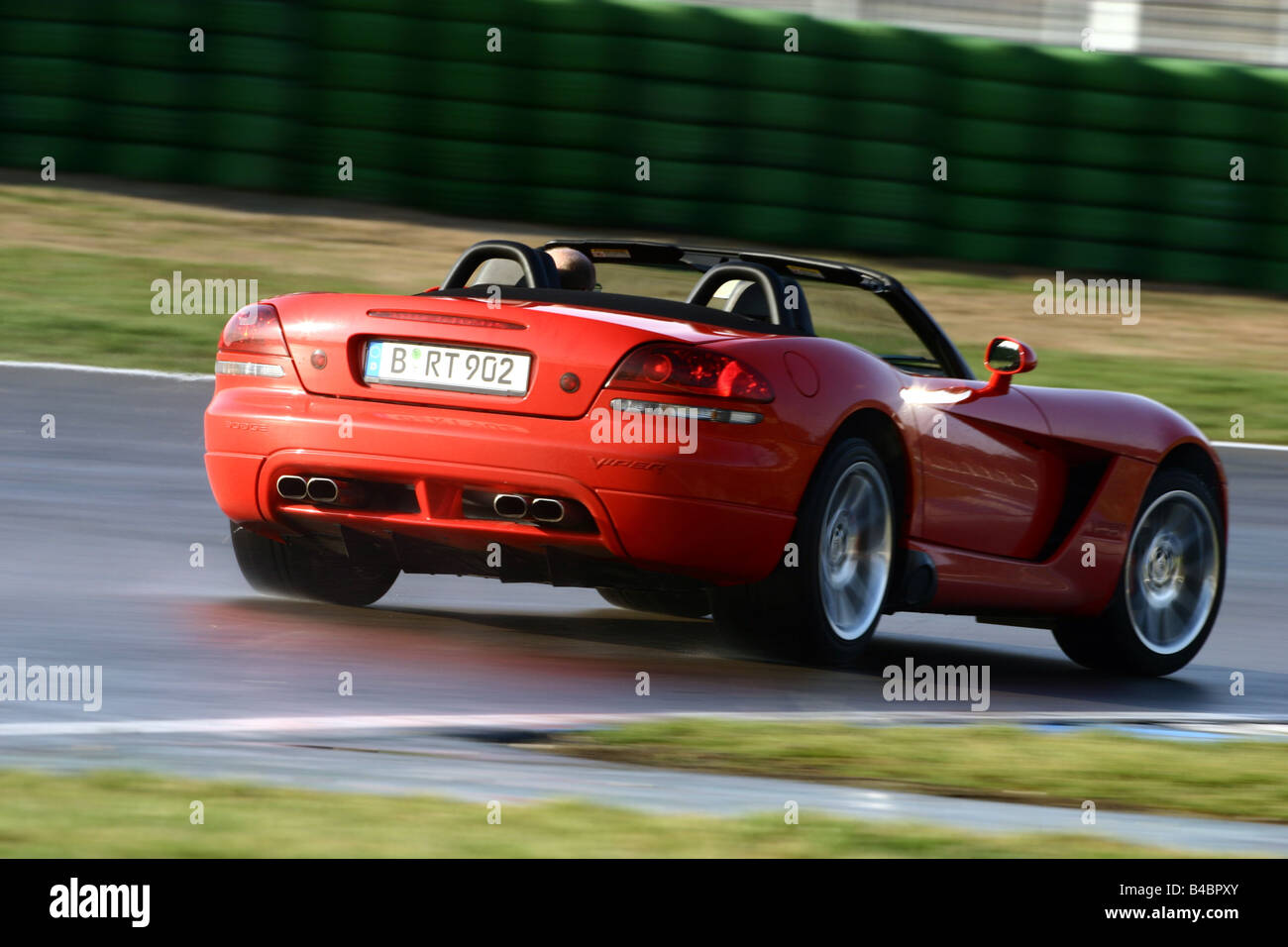 Car, Dodge Viper SRT-10, Convertible, model year 2003-, red, FGHDS, open top, driving, diagonal from the back, rear view, Test t Stock Photo