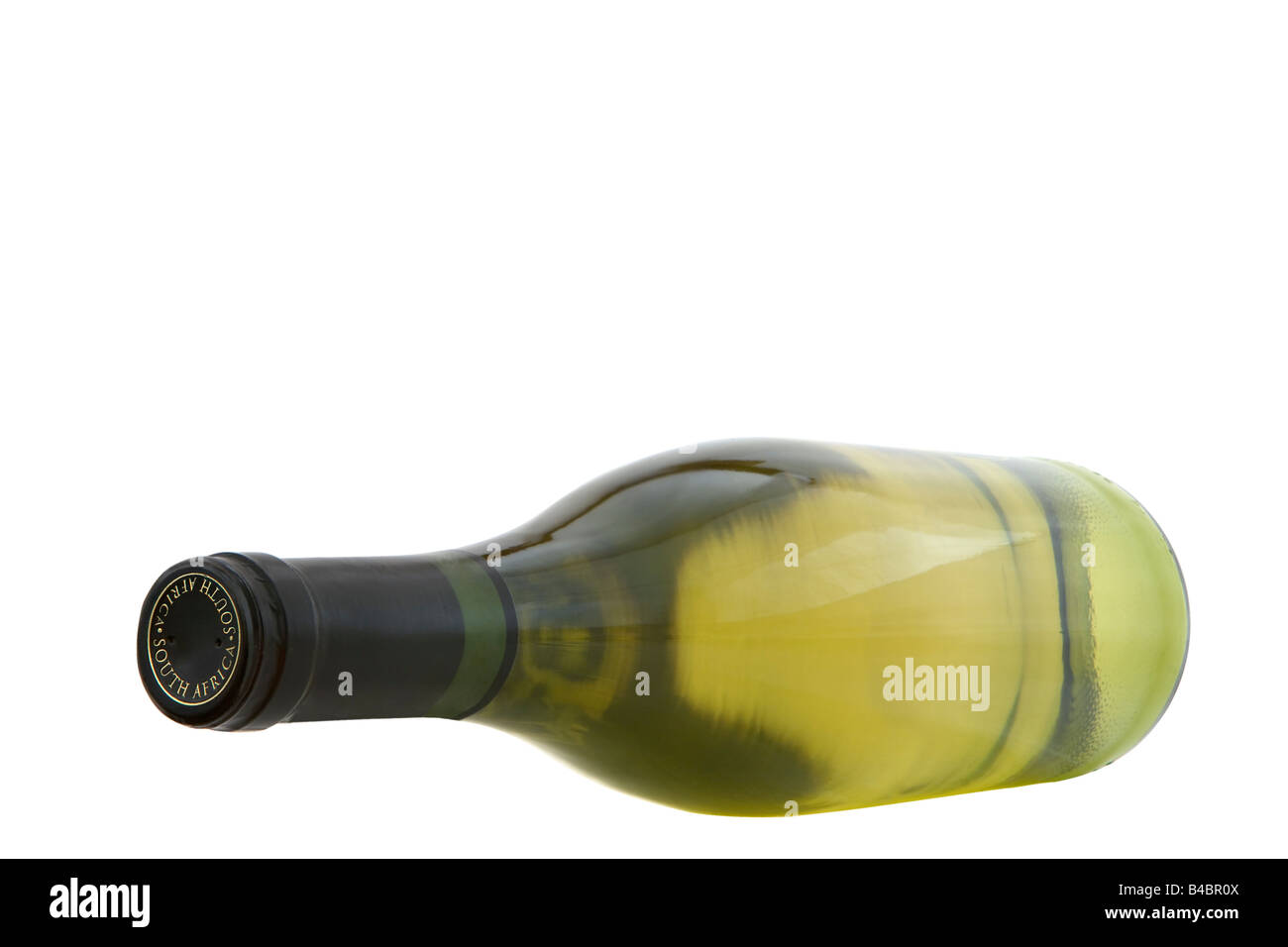 A cut-out of a white wine bottle photographed against a white ...