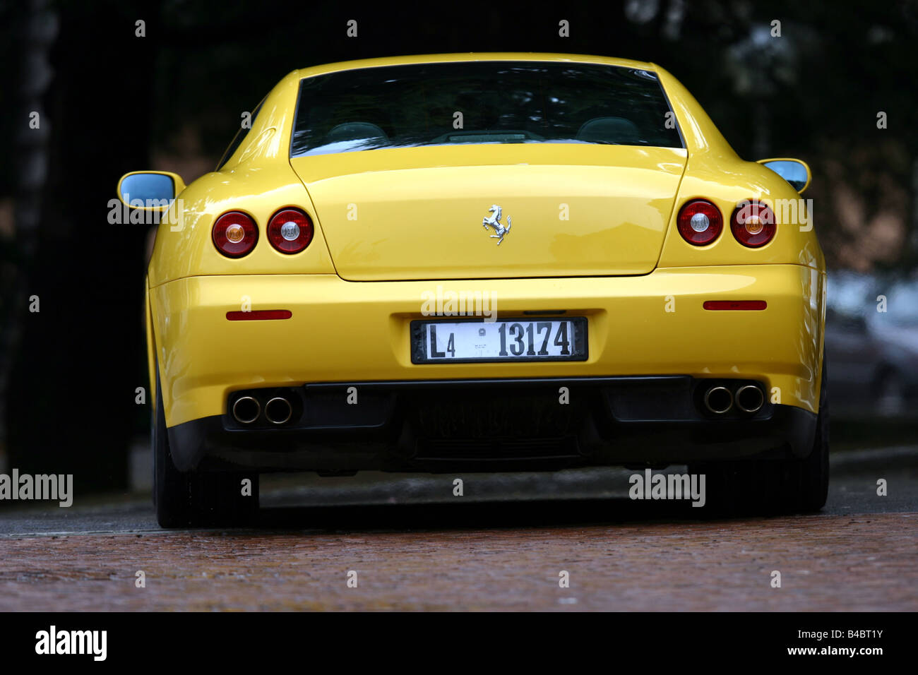 Car, Ferrari 612 Sapprox.lietti, roadster, model year 2004-, coupe/Coupe, yellow, standing, upholding, rear view, photographer: Stock Photo