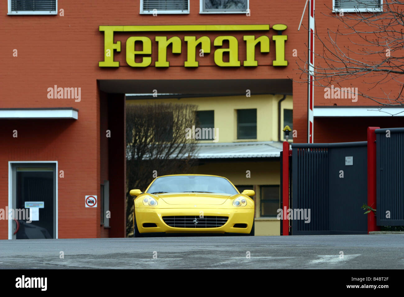 Car, Ferrari 612 Sapprox.lietti, roadster, model year 2004-, coupe/Coupe, yellow, driving, frontal view, City, Ferrari in Marane Stock Photo