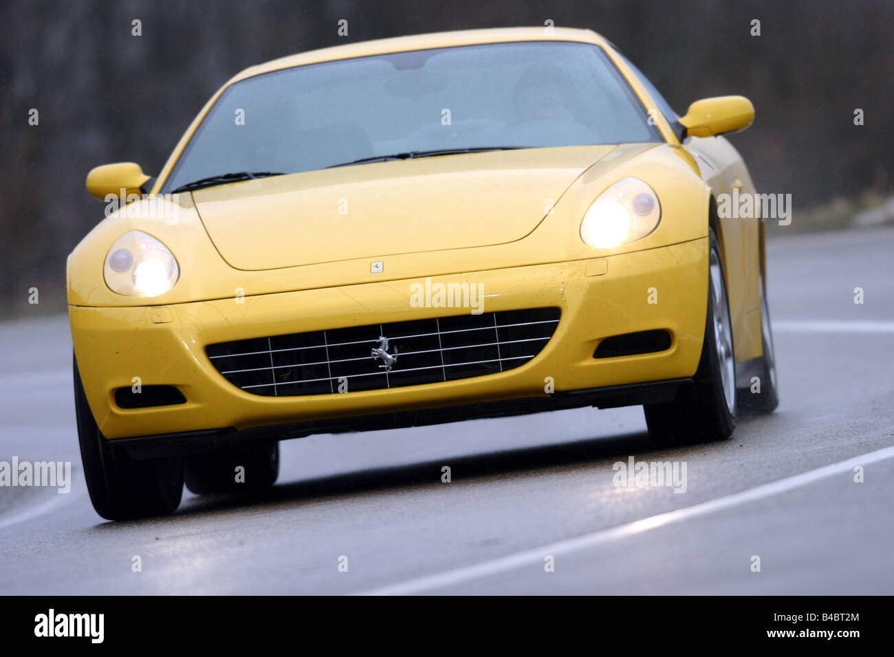 Car, Ferrari 612 Sapprox.lietti, roadster, model year 2004-, coupe/Coupe, yellow, driving, diagonal from the front, frontal view Stock Photo