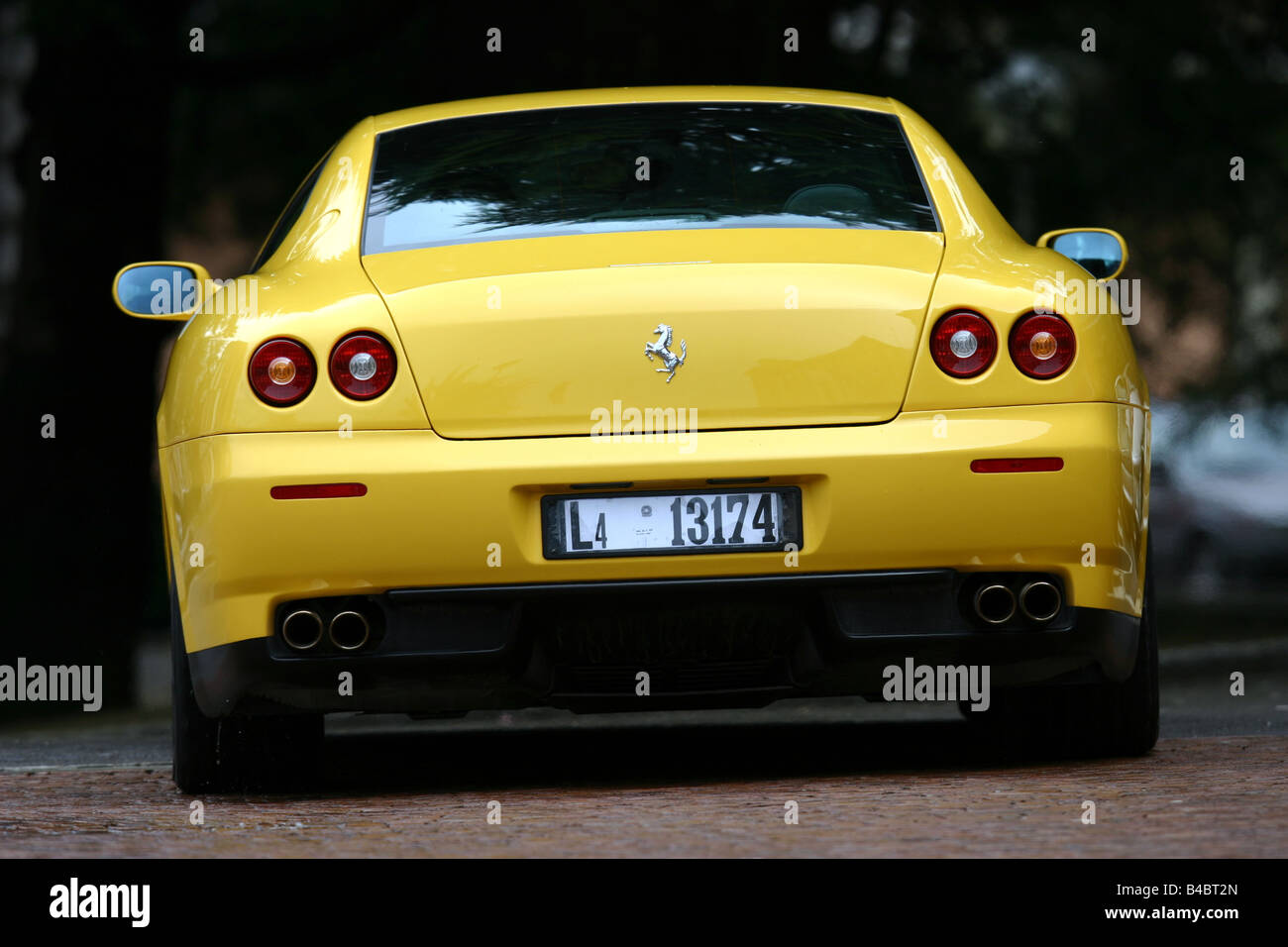 Car, Ferrari 612 Sapprox.lietti, roadster, model year 2004-, coupe/Coupe, yellow, driving, standing, upholding, diagonal from th Stock Photo