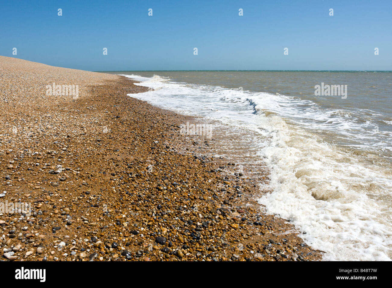 Tide lapping on a shingle beach, on the south coast on England Stock ...