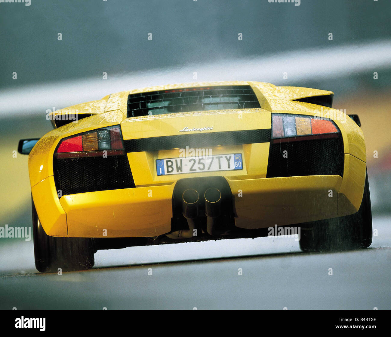 Car, Lamborghinie Murcielago, coupe, roadster, model year 2001-, from the  back, rear view, standing, upholding, yellow, ams 26/2 Stock Photo - Alamy, image size:1300x1118