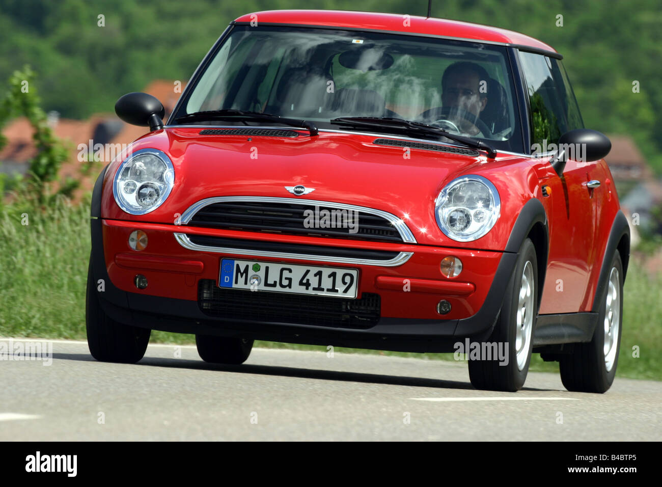 Car, Mini One D, Miniapprox.s, Limousine, model year 2001-, red, driving, diagonal from the front, frontal view, country road, p Stock Photo