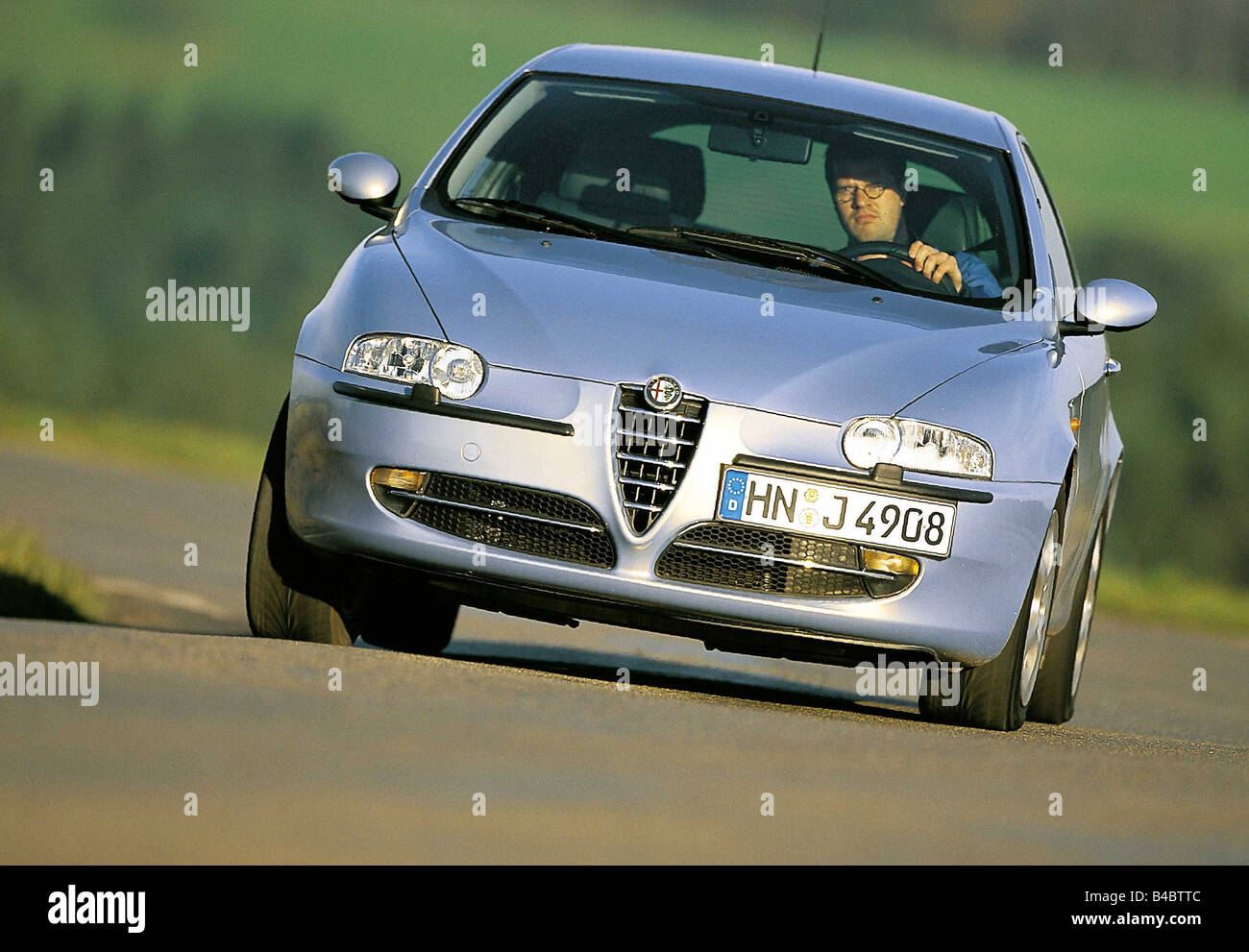 Car, Alfa Romeo 147, Limousine, Lower middle-sized class, model year 2000-, silver, driving, diagonal from the front, ams 26/200 Stock Photo