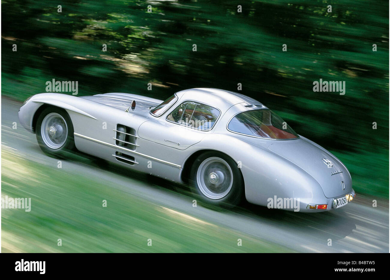 Car, Mercedes 300 SLR, Sports approx.s coupé, model year 1955, 'Uhlenhaut-coupe', Double doors, diagonal from the back, driving, Stock Photo