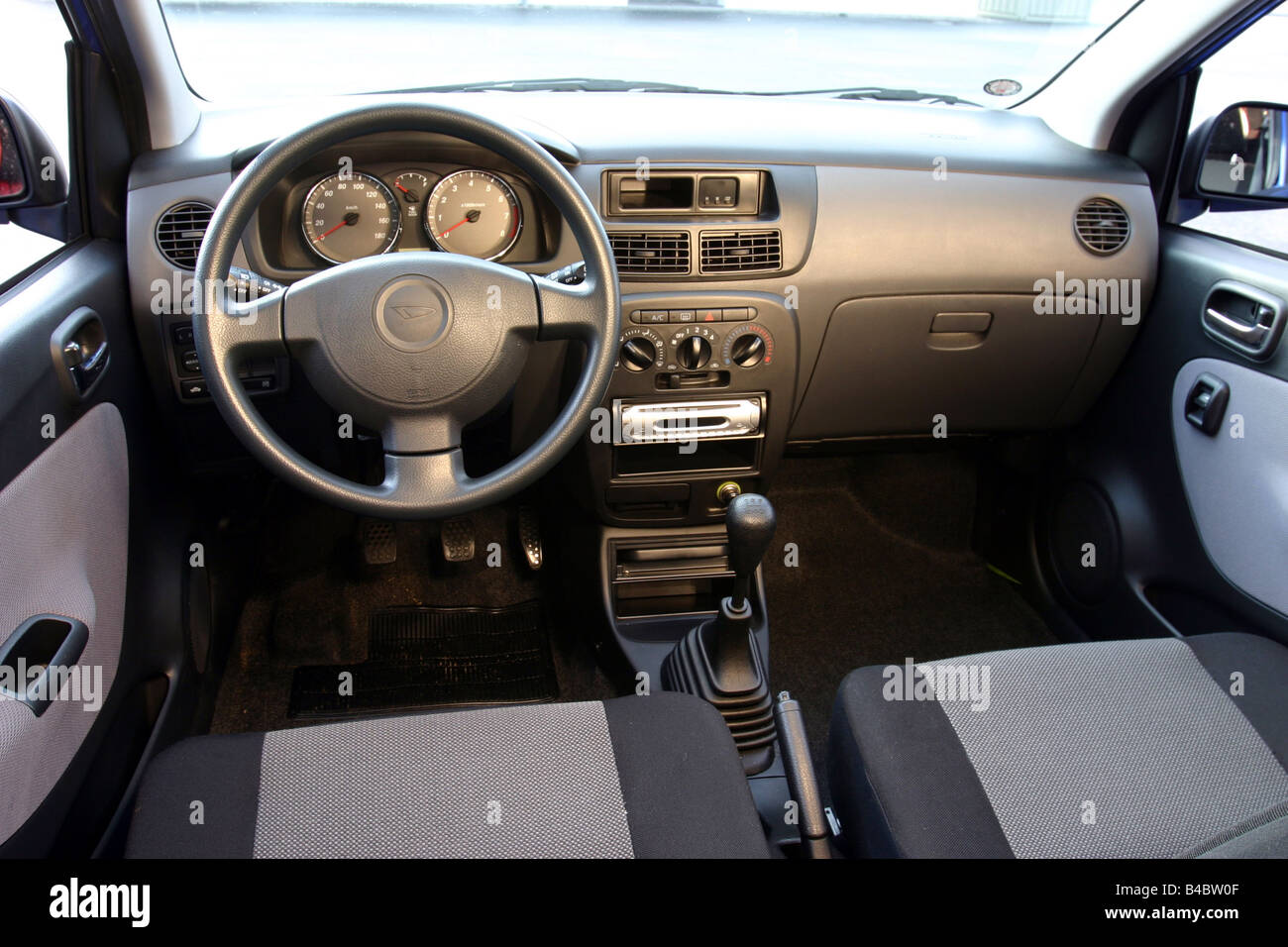 Car, Daihatsu Cuore 1.0 Top, Miniapprox.s, Limousine, model year 2004-, blue, interior view, Interior view, Cockpit, technique/a Stock Photo