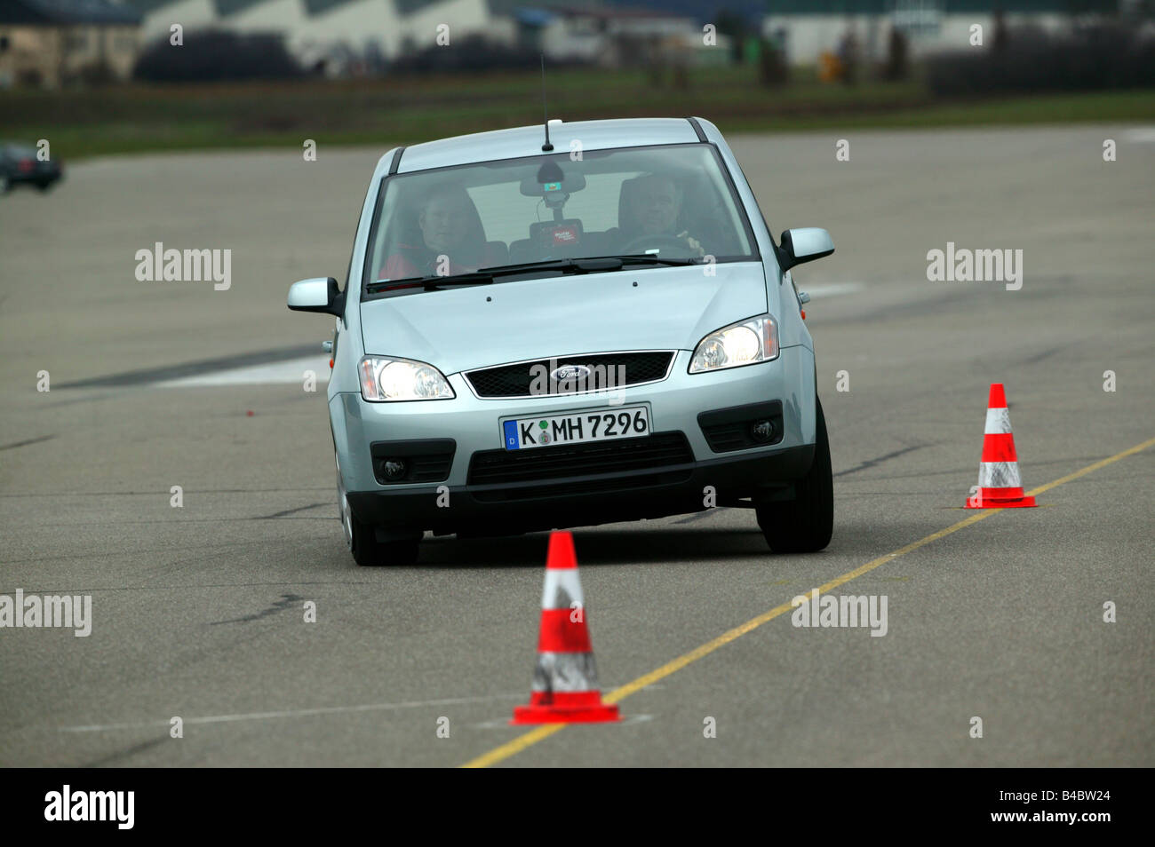 Car, Ford Focus C-Max, Limousine, Lower middle-sized class, model year 2003-, silver, ESP comparison, driving, diagonal from the Stock Photo
